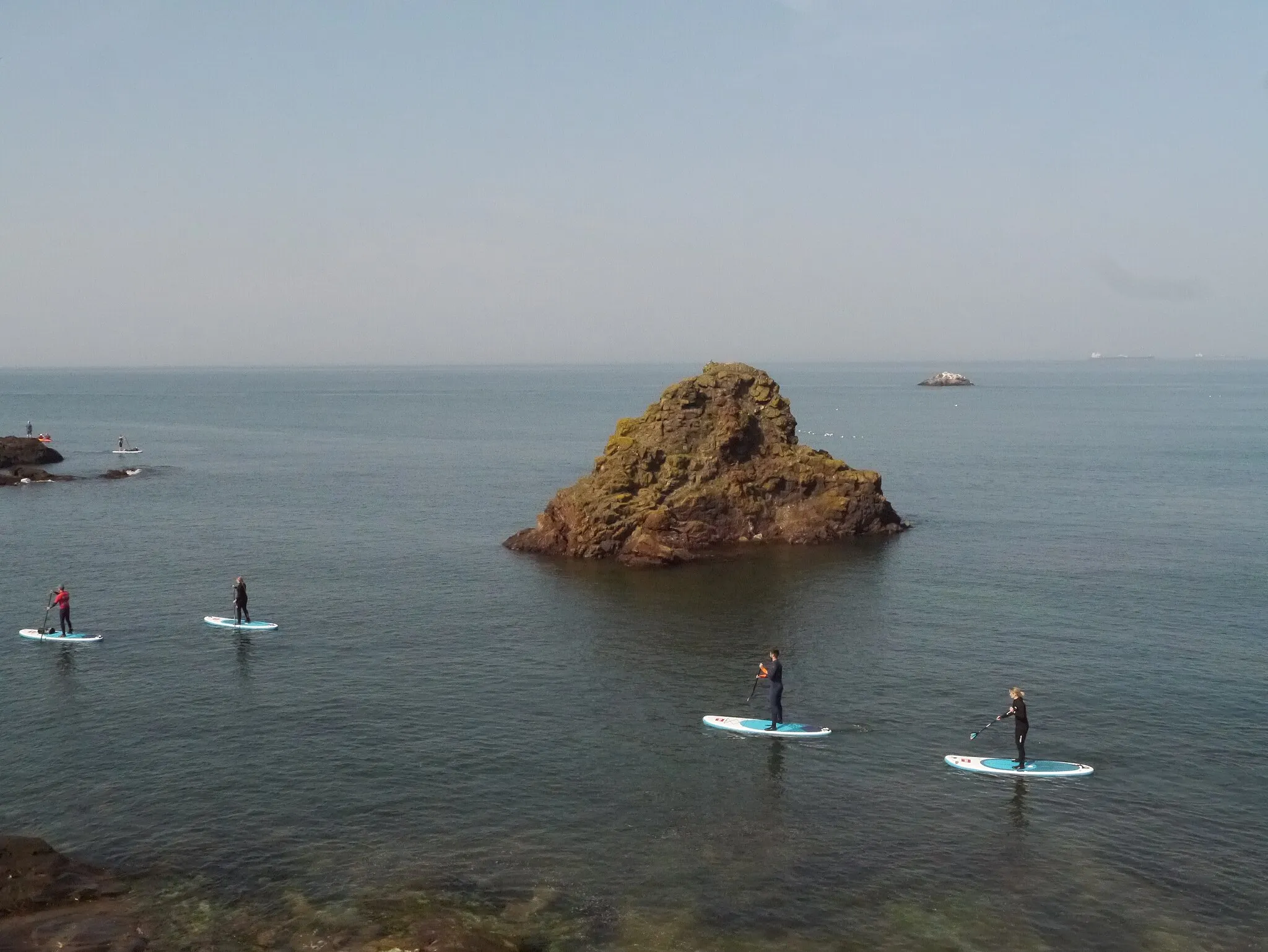 Photo showing: Paddle Boarders at Eye Cave Beach Dunbar