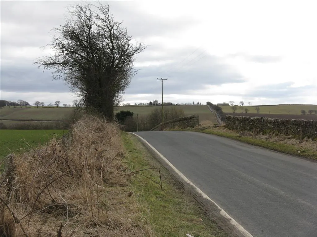 Photo showing: Looking south to Ochiltree Over farmland and the valley of the Haugh Burn. Ochiltree Castle is on the skyline in the centre, about 1.5 km away.