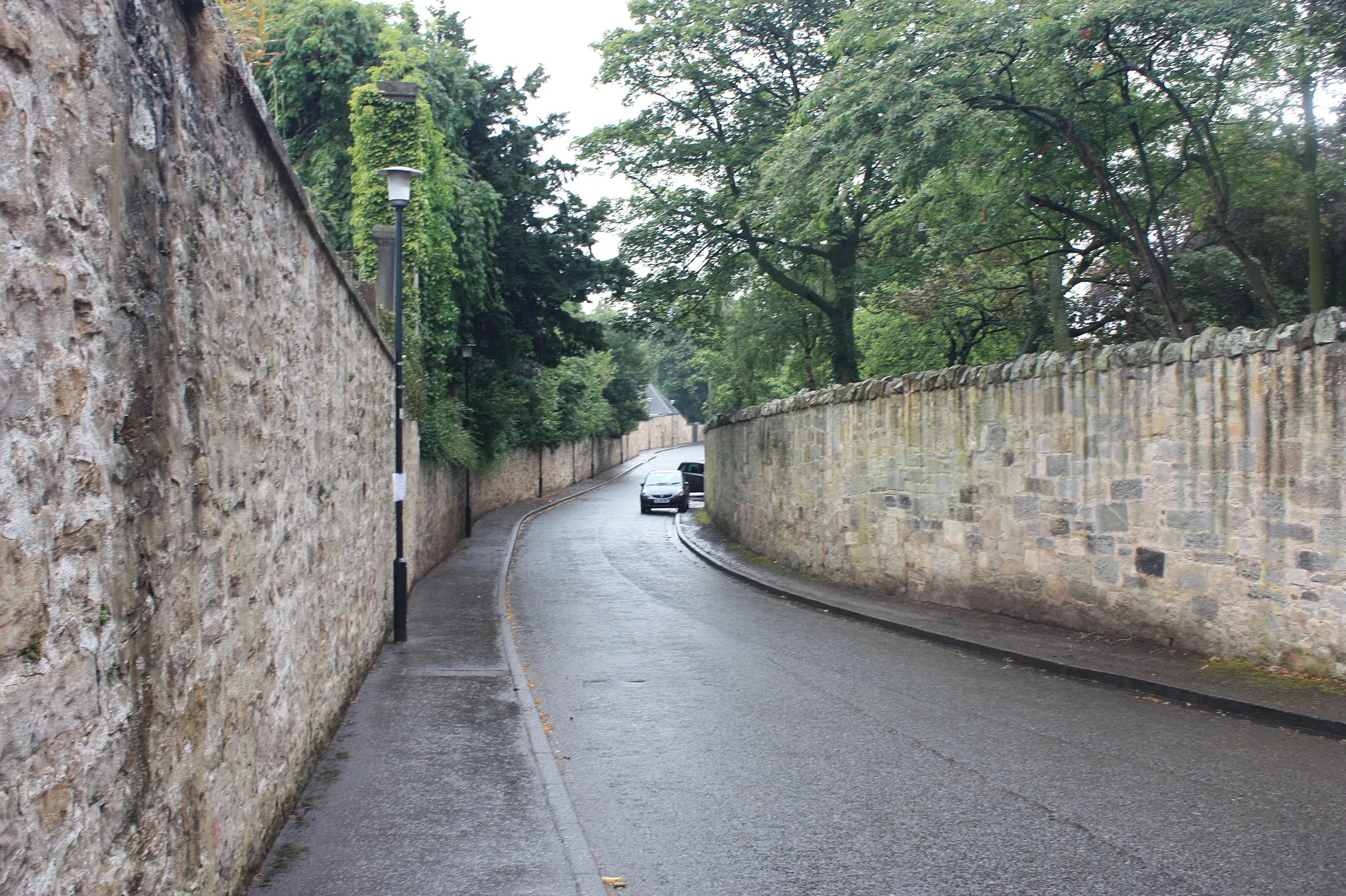 Photo showing: The western section of Inveresk Village is typified by high stone walls and mansionhouses screened by trees