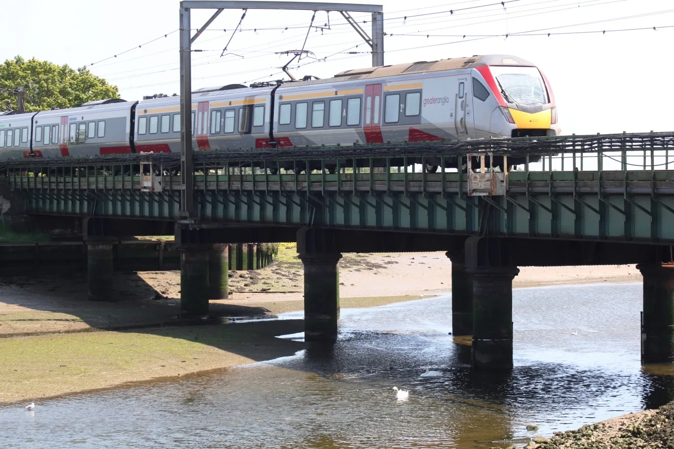 Photo showing: The rear end of Greater Anglia 'Flirt' electric unit 745003 crosses the Cattawade Viaduct as it heads away from Maningtree with a London to Norwich service.