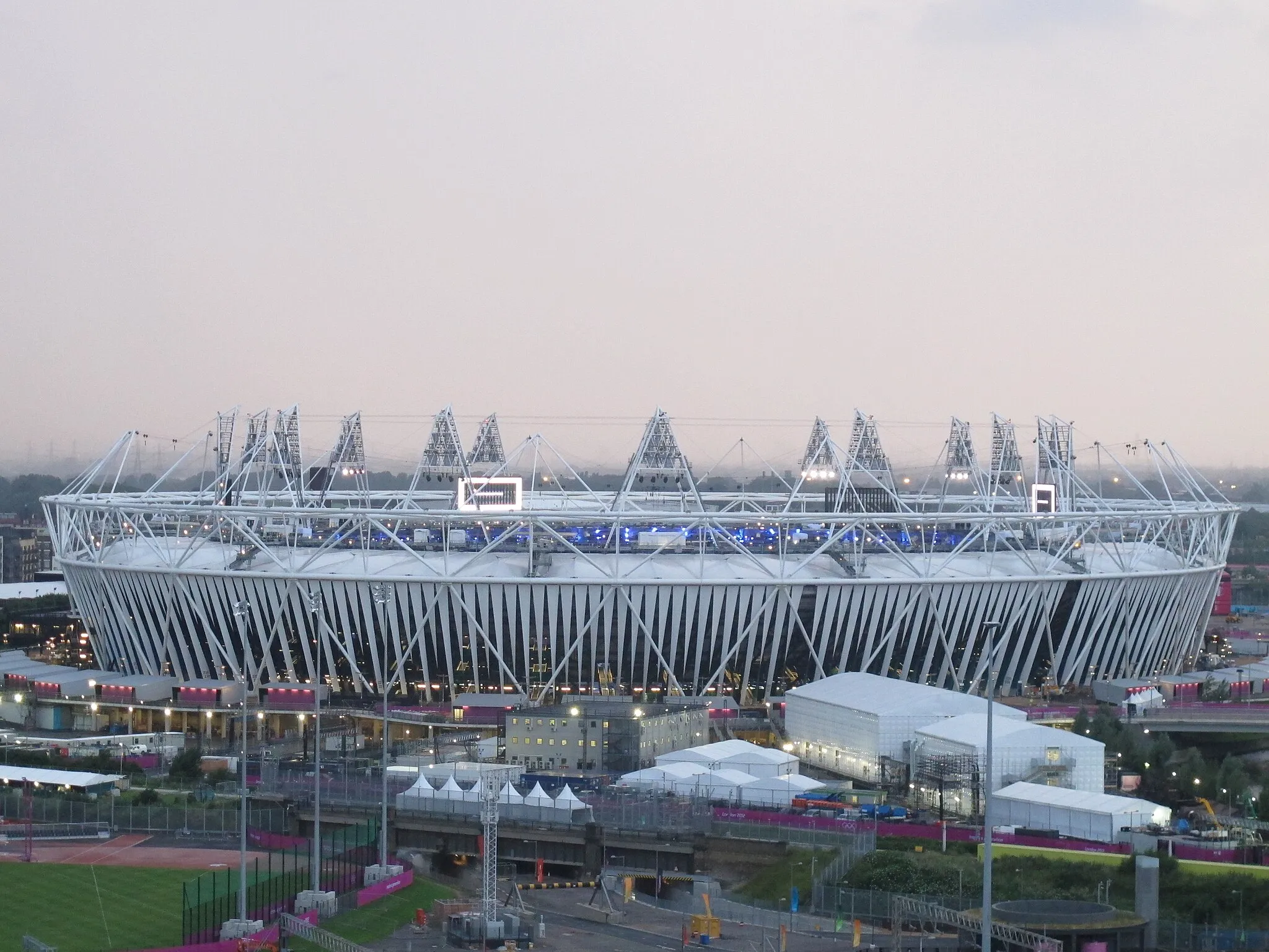 Photo showing: A close-up of the Stadium - the screens were on as they were practicing elements of the opening ceremony (which they've been practicing for the last 10 days or so). The wrap went up about a week ago.