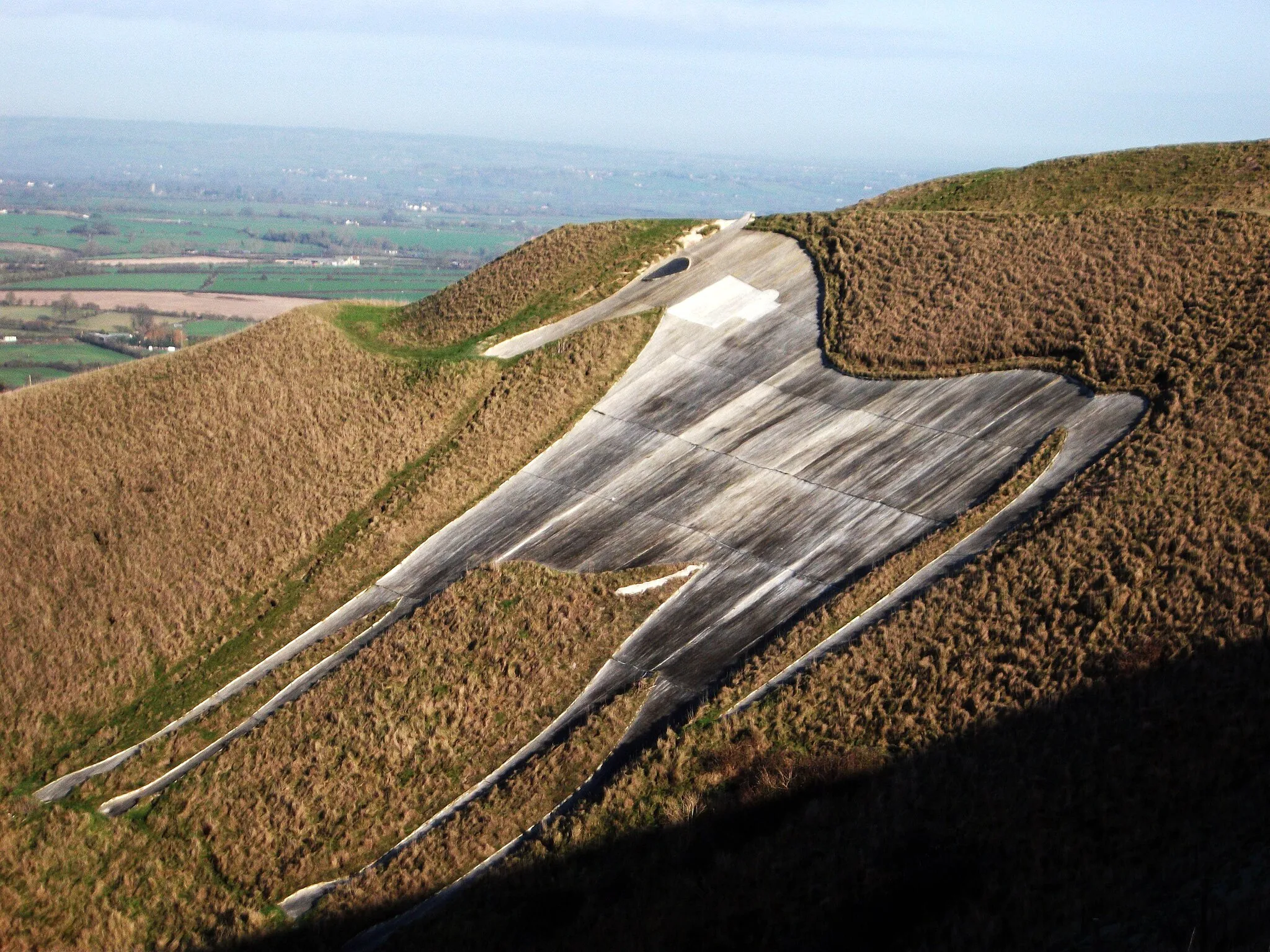Photo showing: The Westbury White Horse in 2012 following an unsuccessful attempt at restoration in 2007