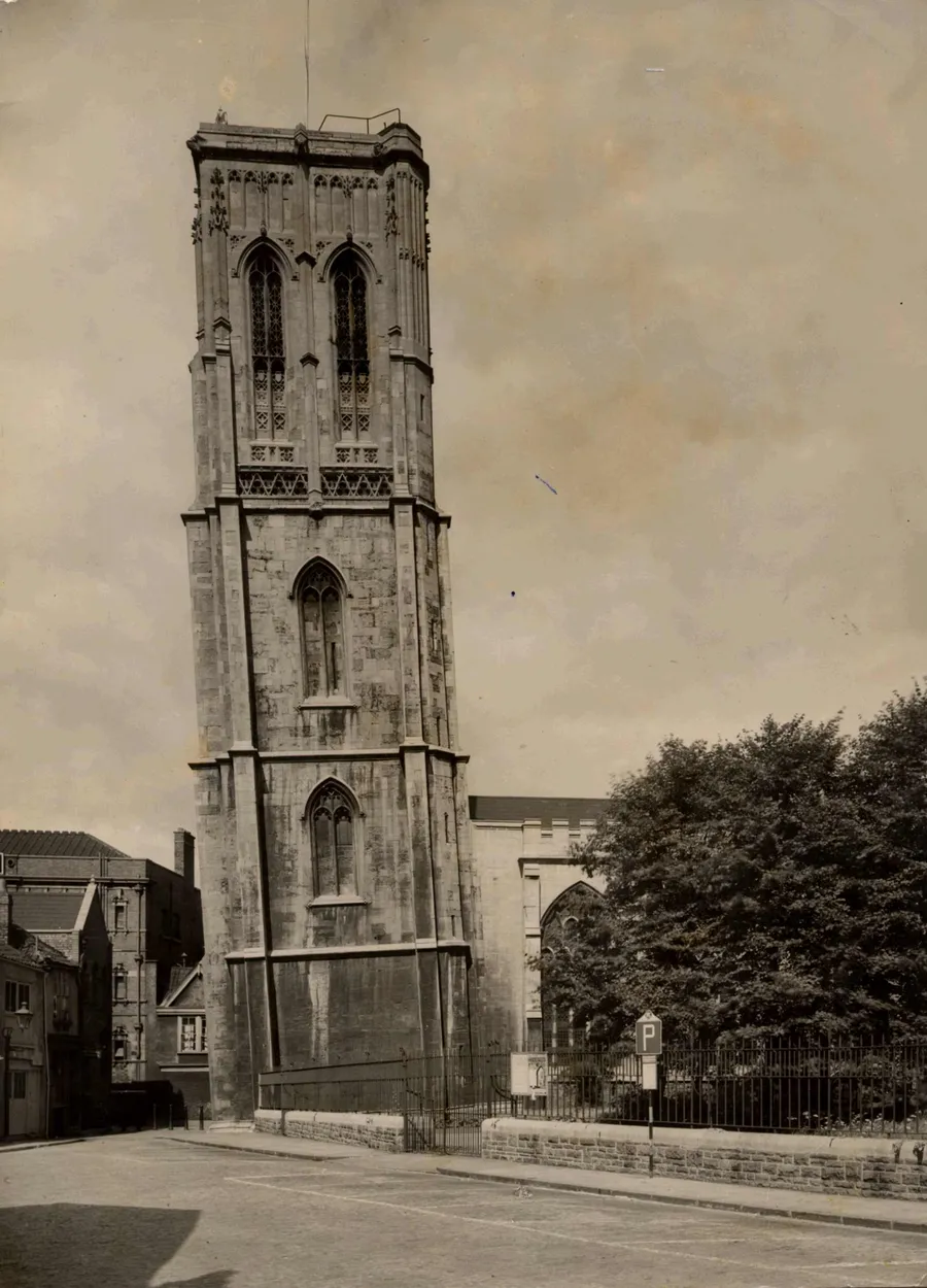 Photo showing: Black and white photograph of Temple Church, Bristol, England, taken before the Second World War. The view is from the south of the church showing the lean of the medieval tower. The church was bombed heavily destroying the stores of records kept in the cellars and leaving only the leaning tower and outside walls standing.