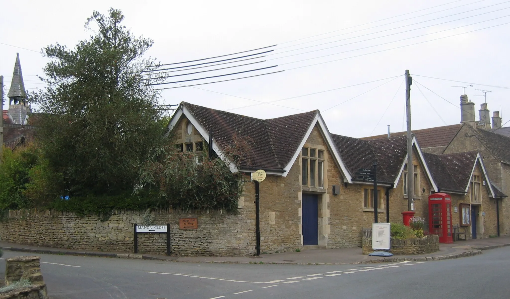 Photo showing: en:Kington St Michael village centre (the tower to the left is the village hall)