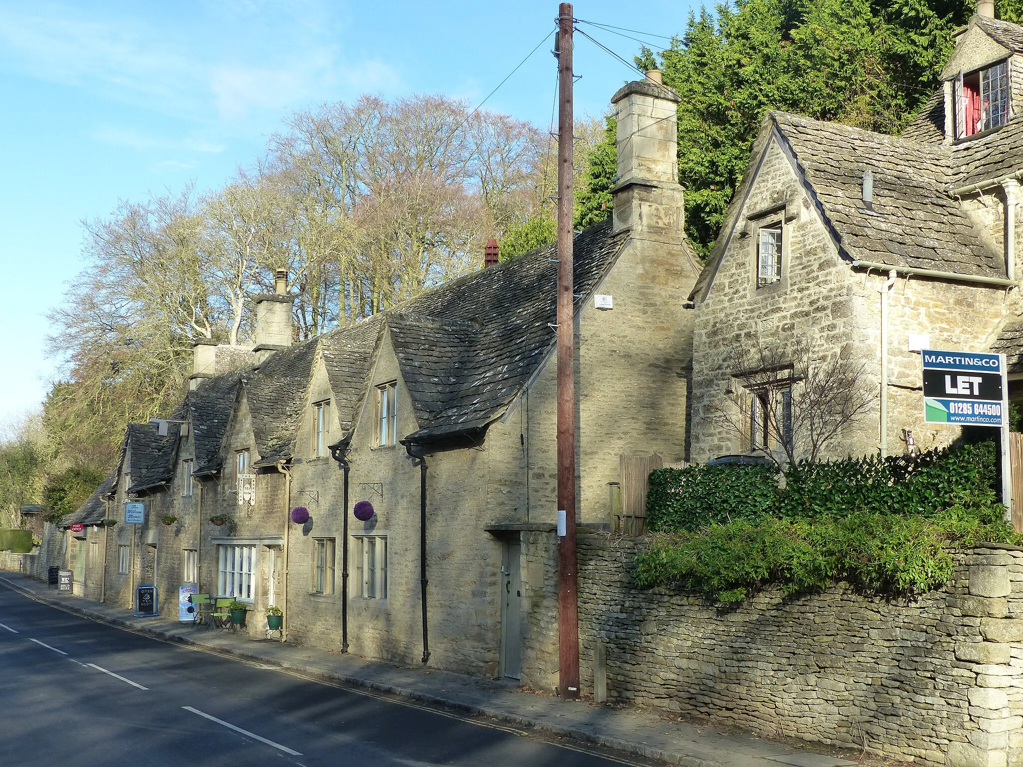 Photo showing: Grade II listed houses in Bibury, Gloucestershire. Listed as "10 and 11, the Street, and No 12 (Troutbeck Cottage)". Wikidata has entry 10 and 11, the Street, and No 12 (Troutbeck Cottage) (Q26448180) with data related to this item.
