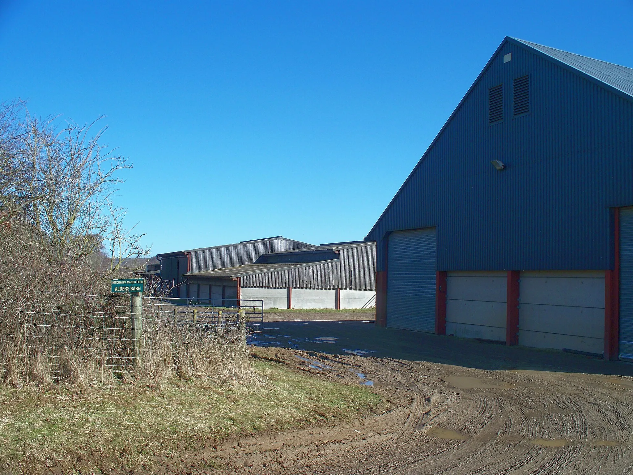 Photo showing: Alders Barns [2] There are four large storage barns here, part of Hinchwick Manor Farm.