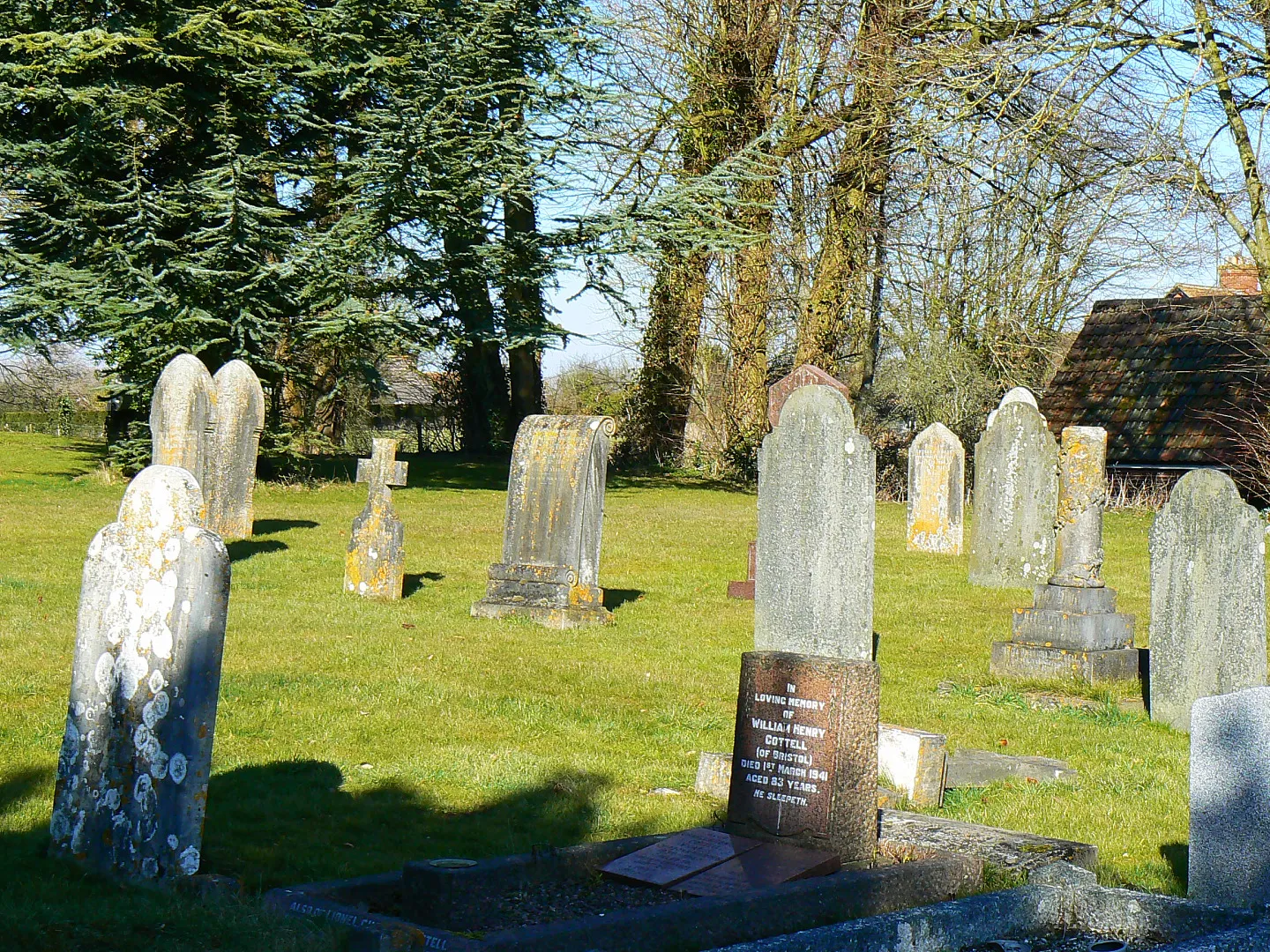 Photo showing: Churchyard, St John the Baptist, Chirton. The churchyard is quite large. This shows the part south of the church itself. The truncated pillar grave marker seen in this image 1742226 is at the right.
