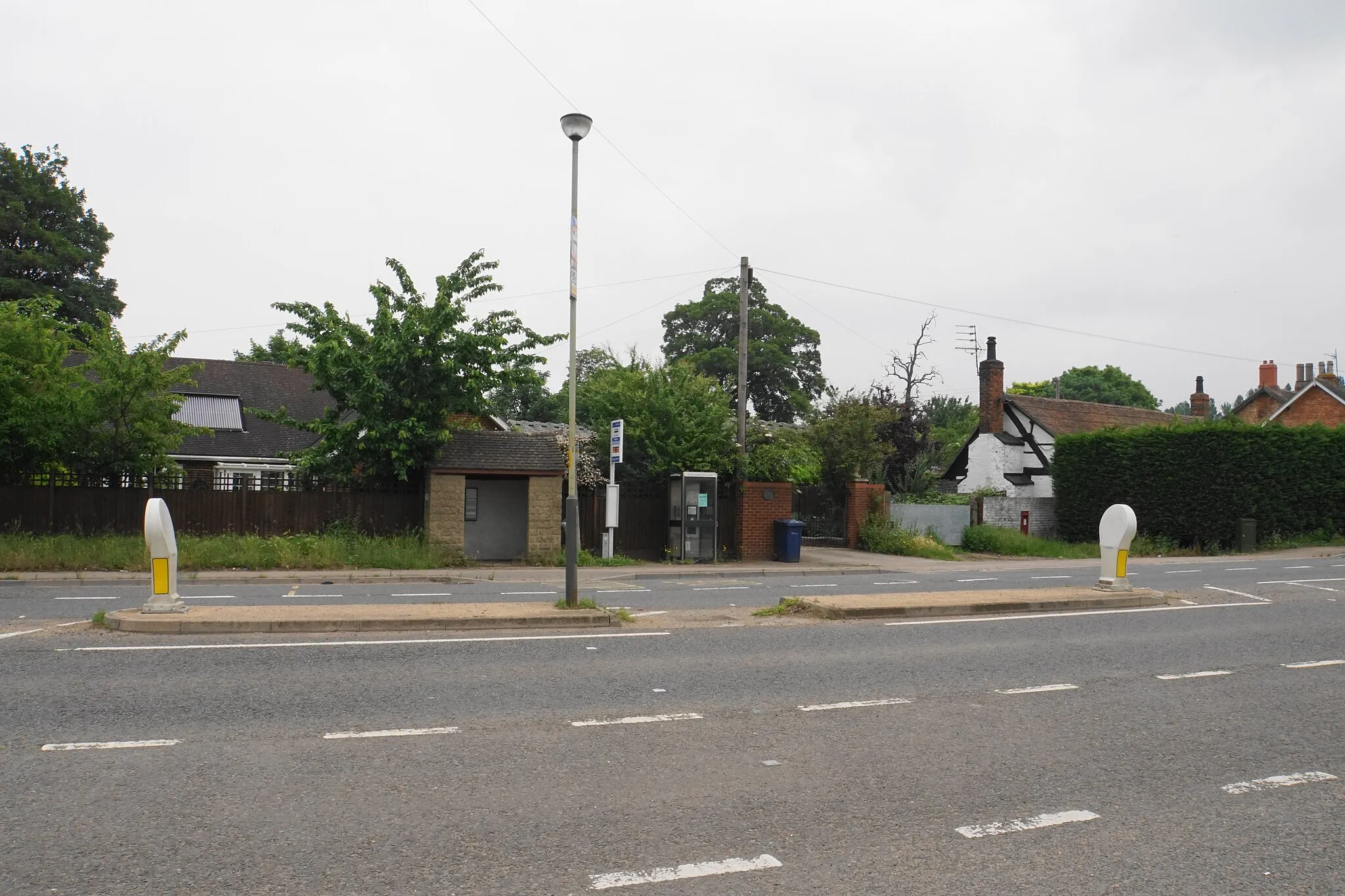 Photo showing: Bus stop and phone box in Uckington