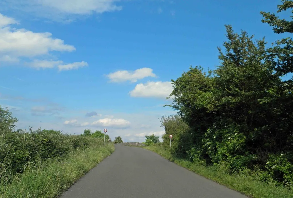 Photo showing: Ahead is the bridge over the disused railway now a trail