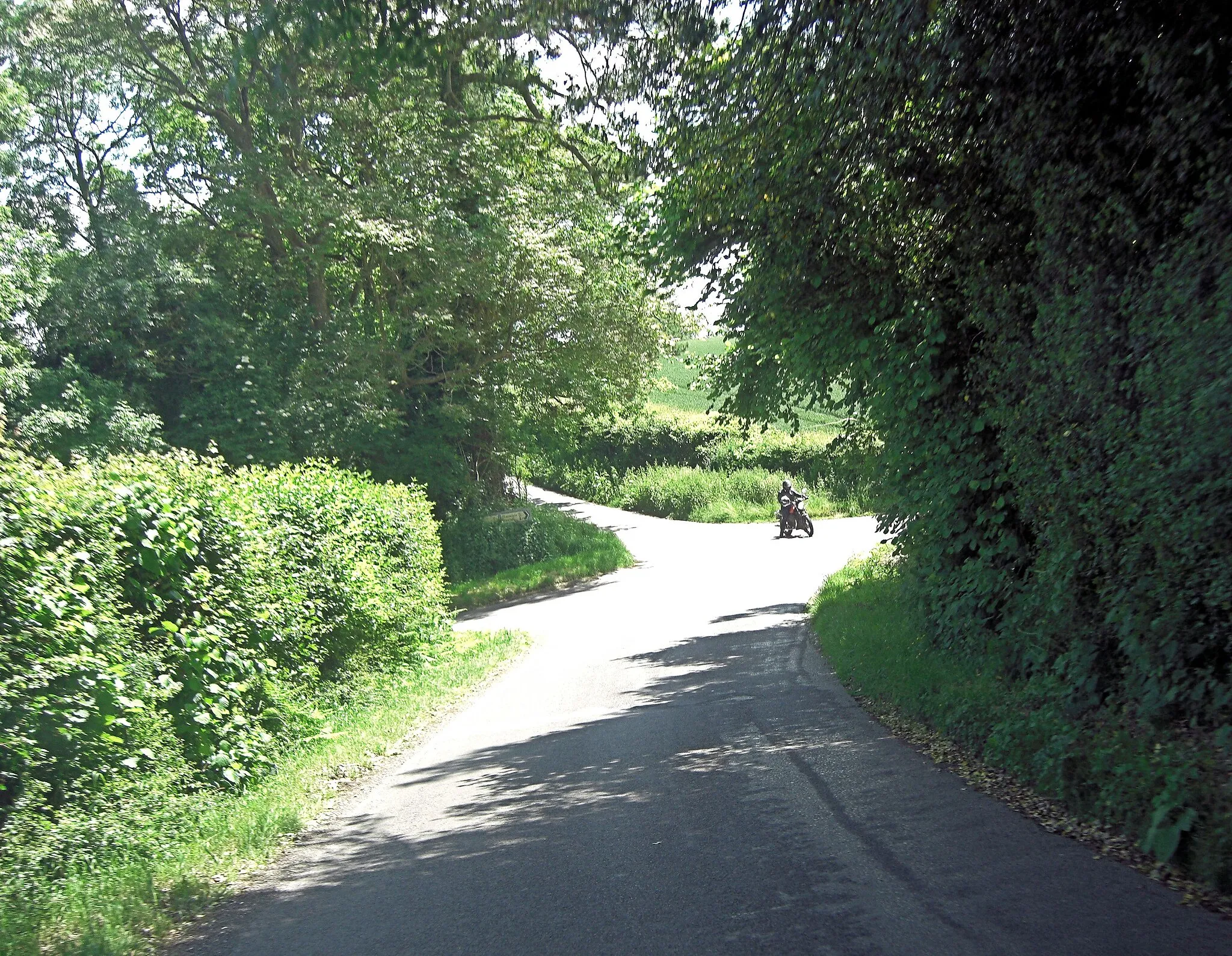 Photo showing: Biker at Waters Well Cross