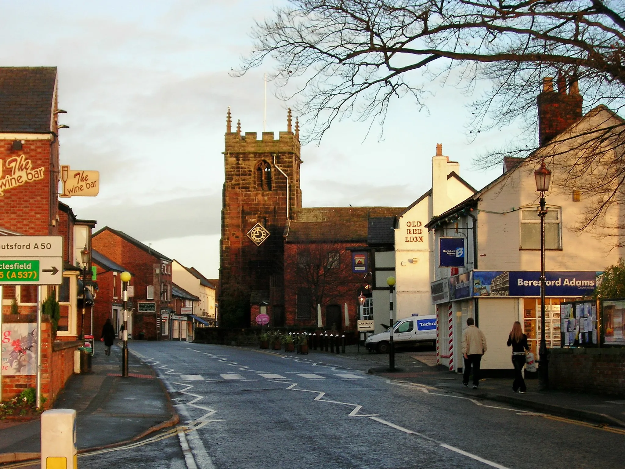 Photo showing: Holmes Chapel, view looking north along the A50 towards the main church and the 'old red lion' pub