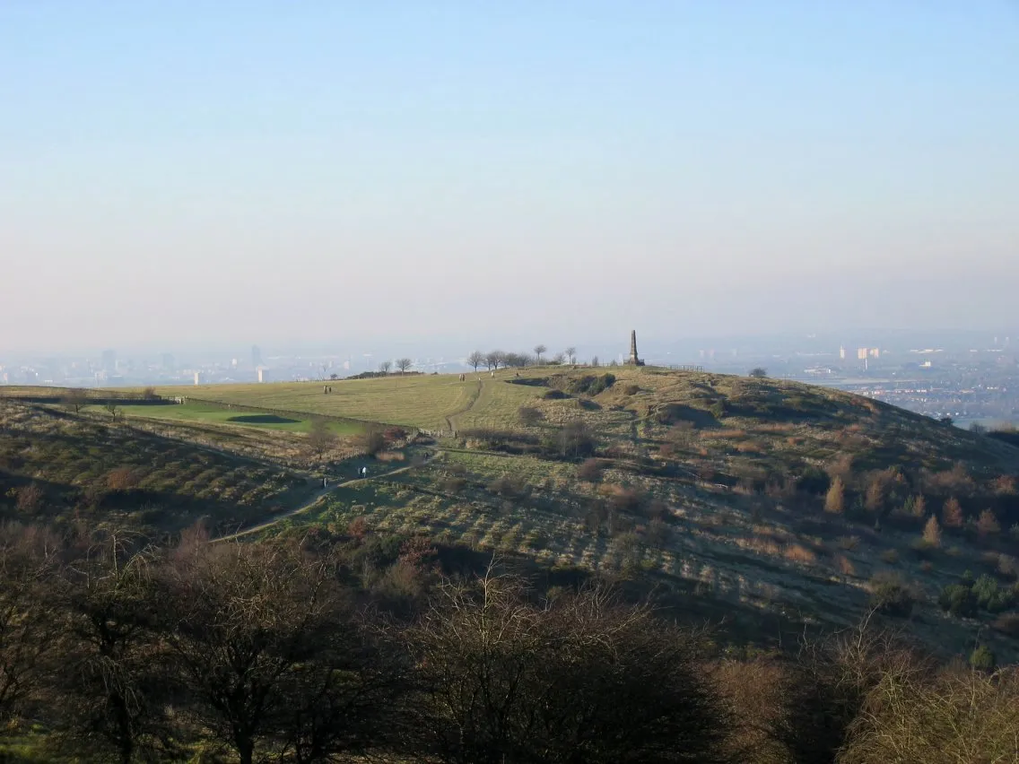 Photo showing: Werneth Low near Hyde, Greater Manchester, on a hazy January day.  The Manchester conurbation is in the background.
