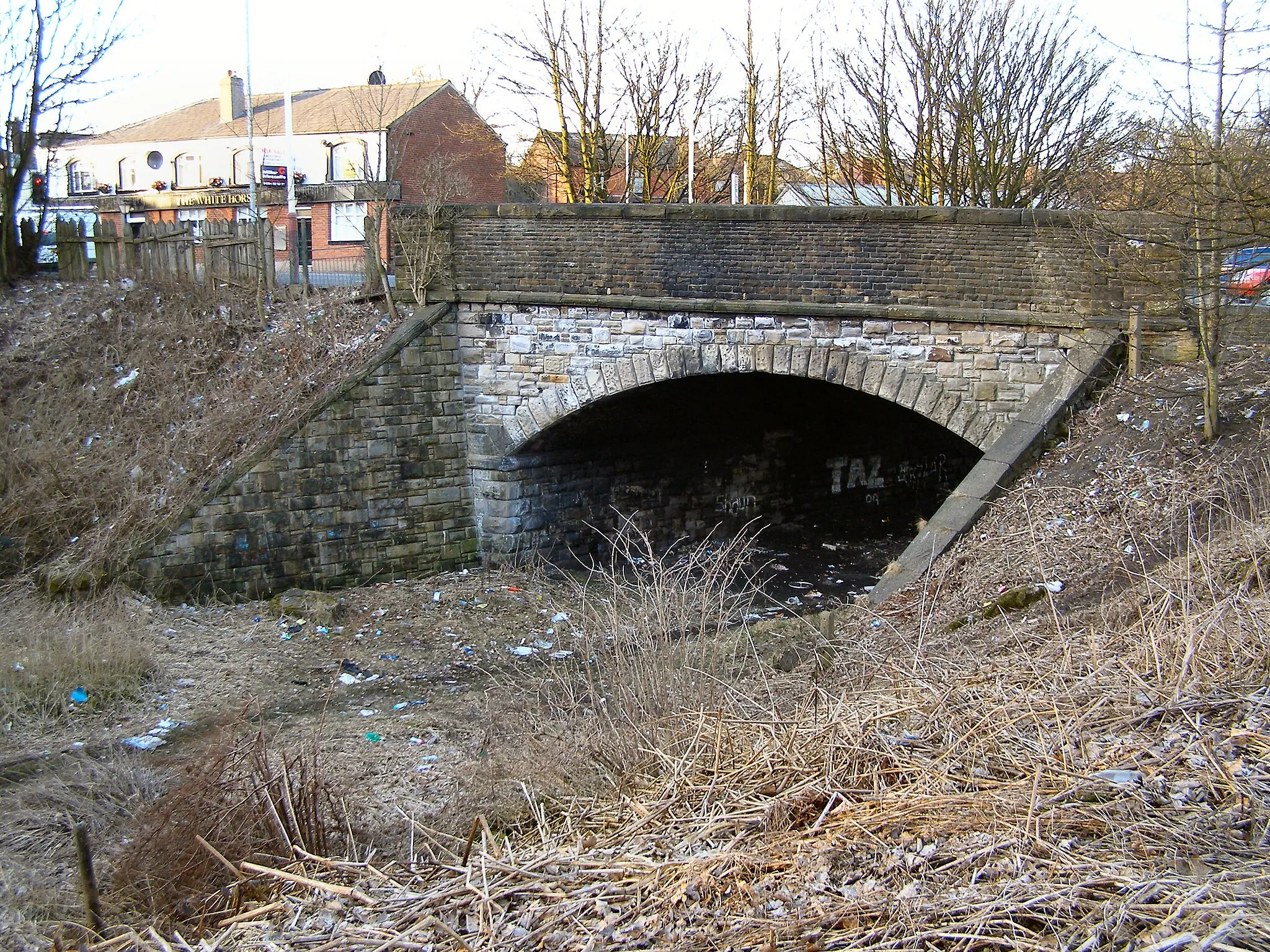 Photo showing: Bolton Road Bridge Bridge carrying Bolton Road over the course of the (now disused) railway at Kearsley.