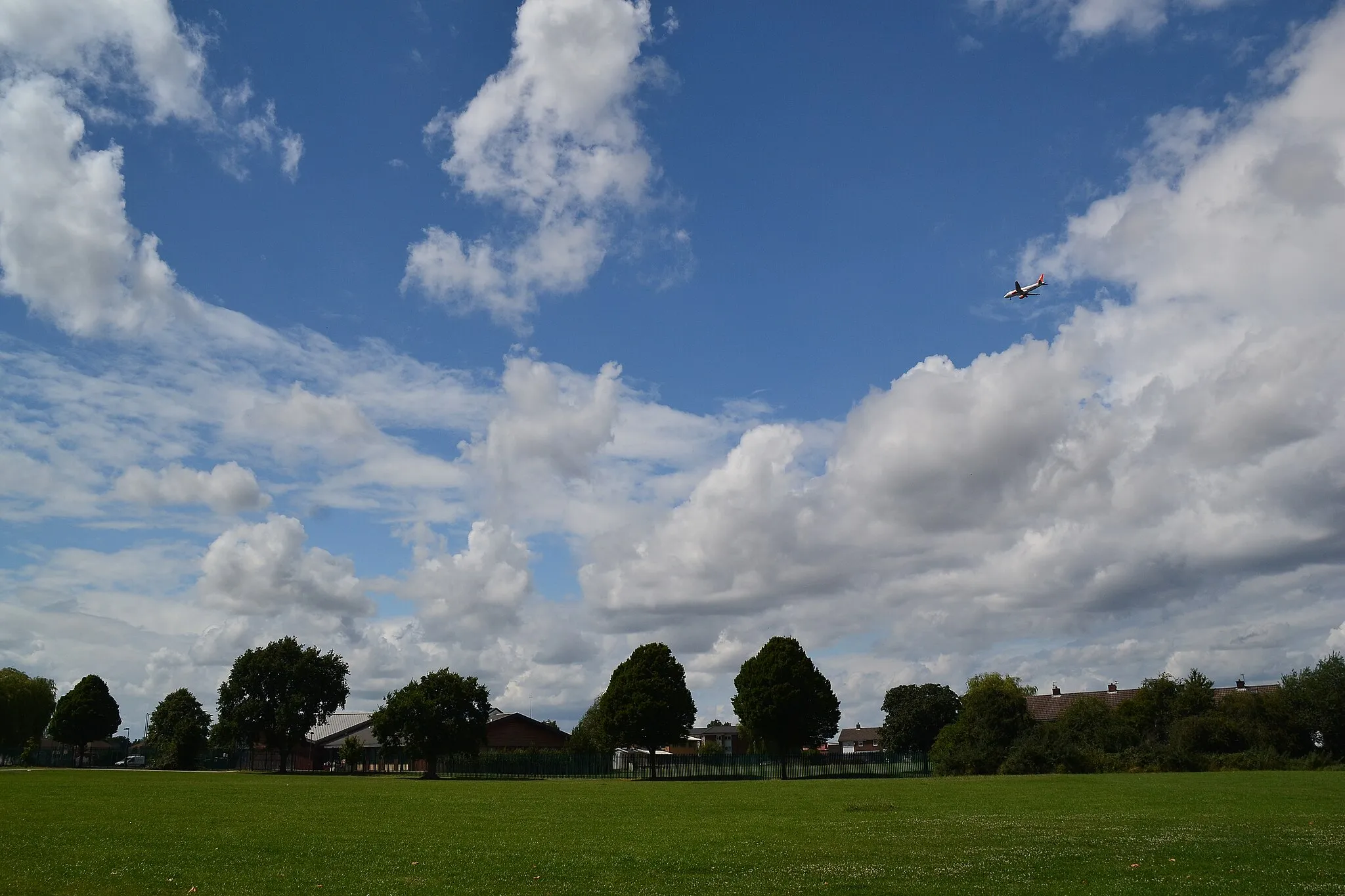 Photo showing: Addswood Park, with plane approaching Manchester