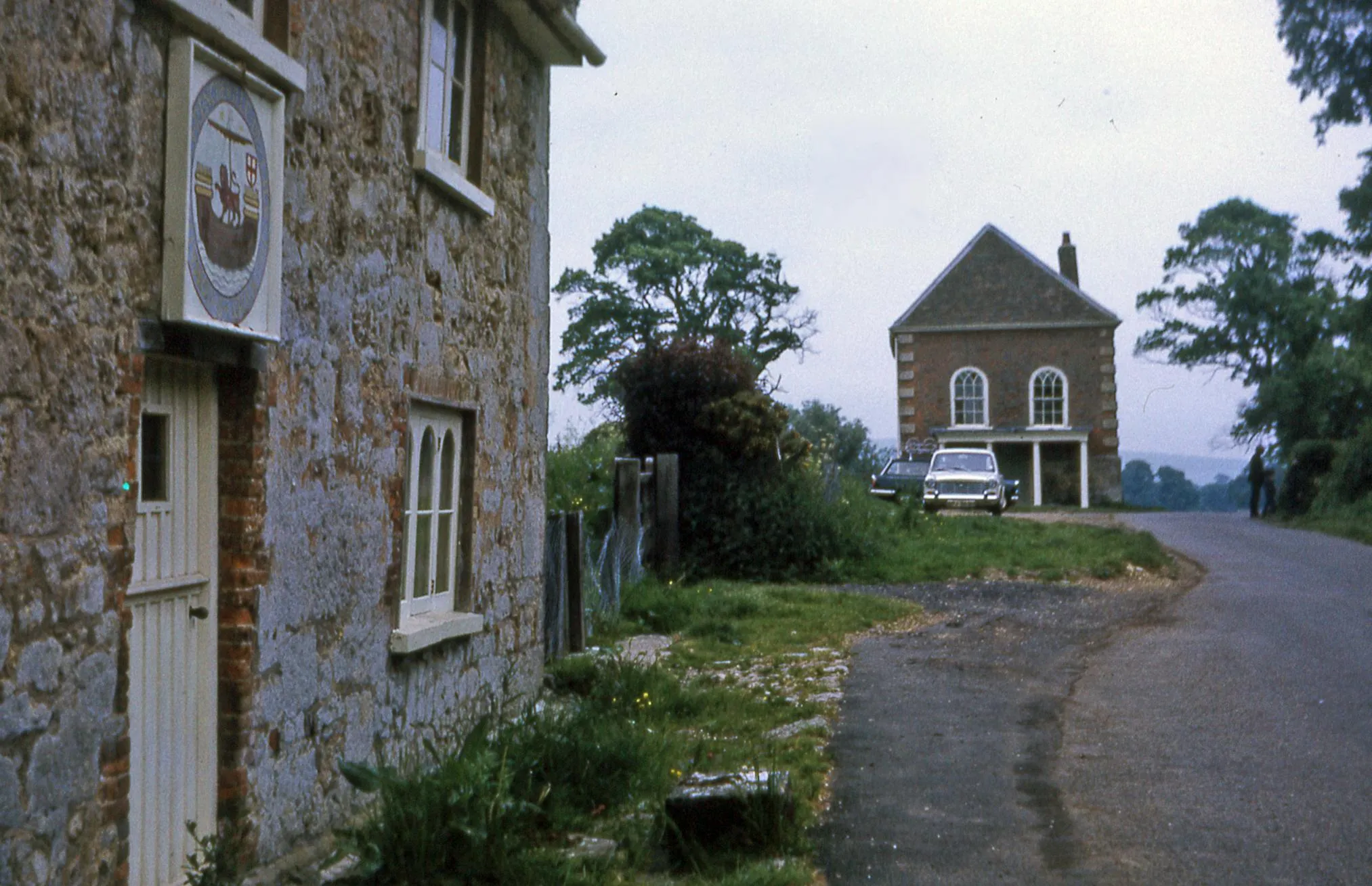 Photo showing: Newtown Town Hall on the Isle of Wight.  The building in the distance is the Newtown Old Town Hall, owned by the National Trust, the nearby one has been named Noahs Ark by the house owners.