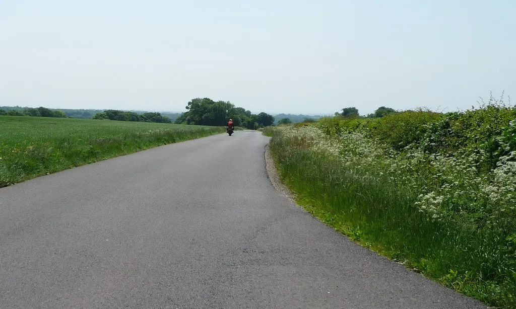 Photo showing: Biker heading south at Lane End Down