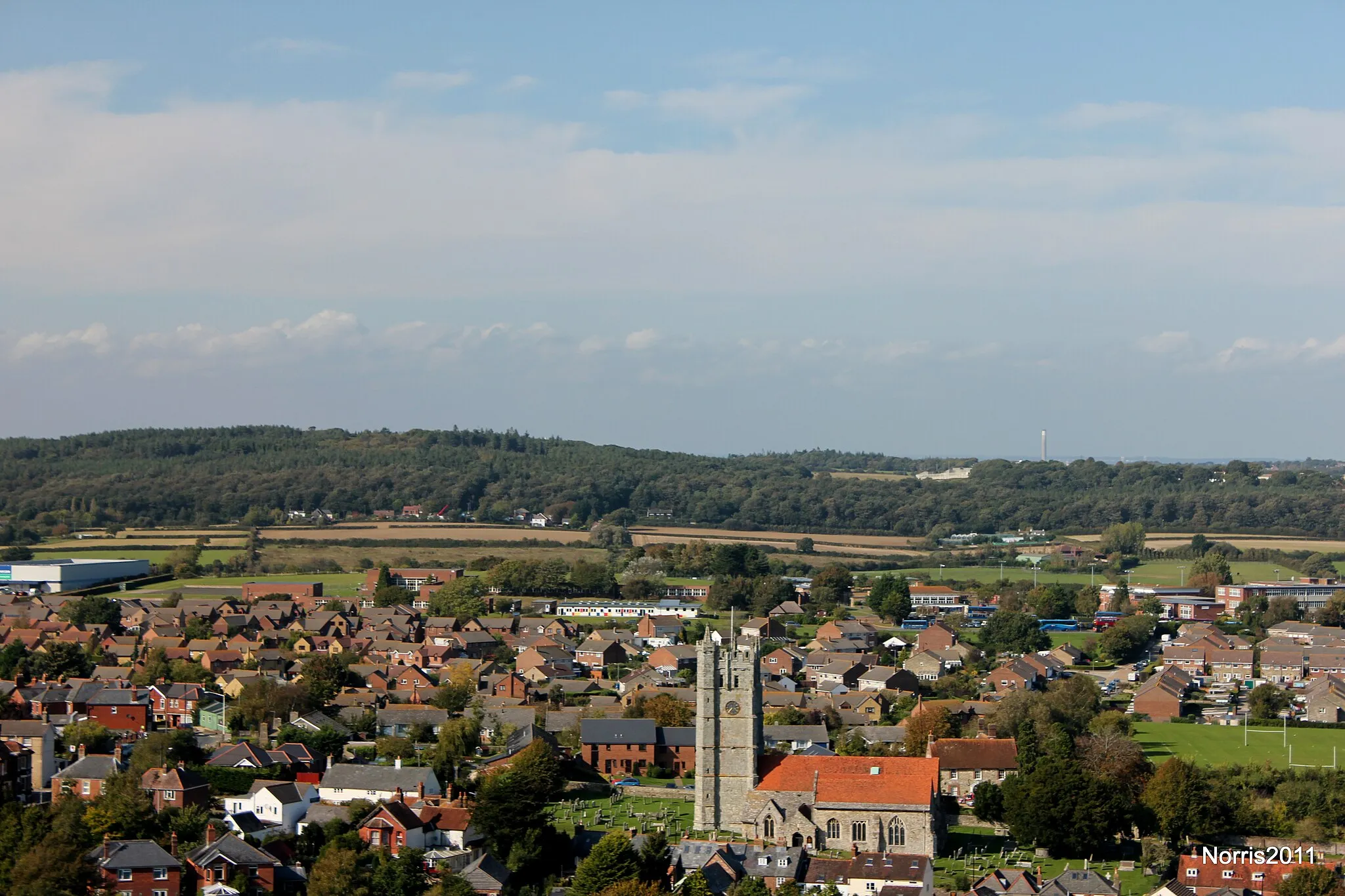 Photo showing: Across Carisbrooke. Fawley power station chimney in the distance.