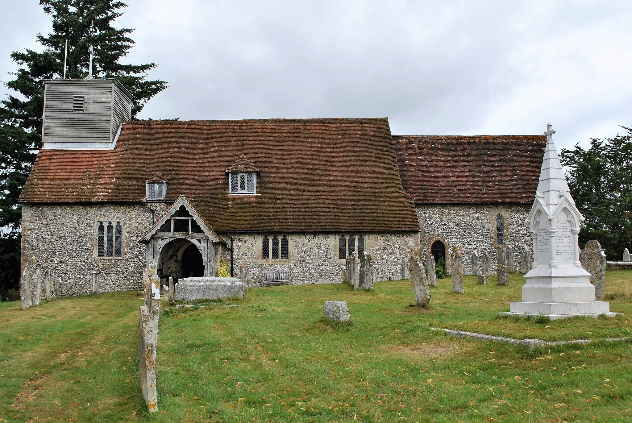 Photo showing: Parish church of St Margaret of Antioch, East Wellow, Hampshire, seen from the south. The monument on the right marks the grave of Florence Nightingale.