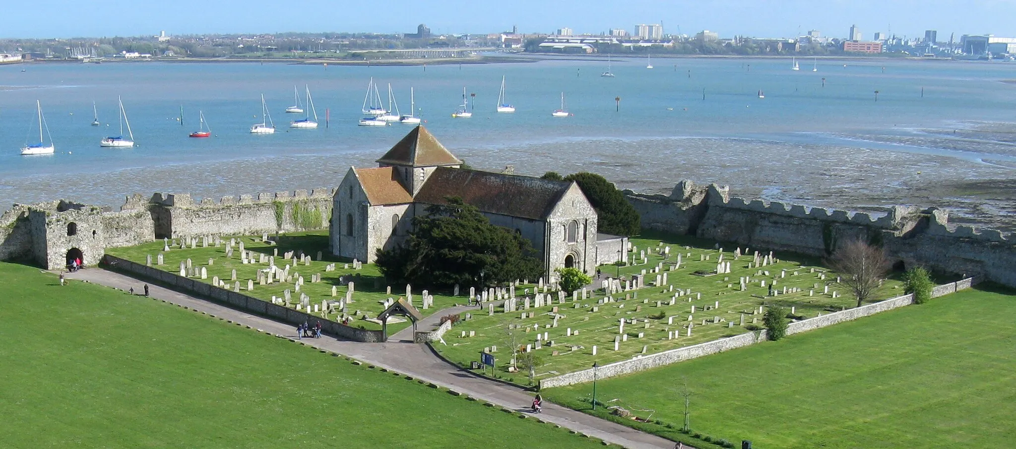 Photo showing: The 12th-century church within the outer bailey of Portchester Castle was founded for the priory. It is now the parish church.
