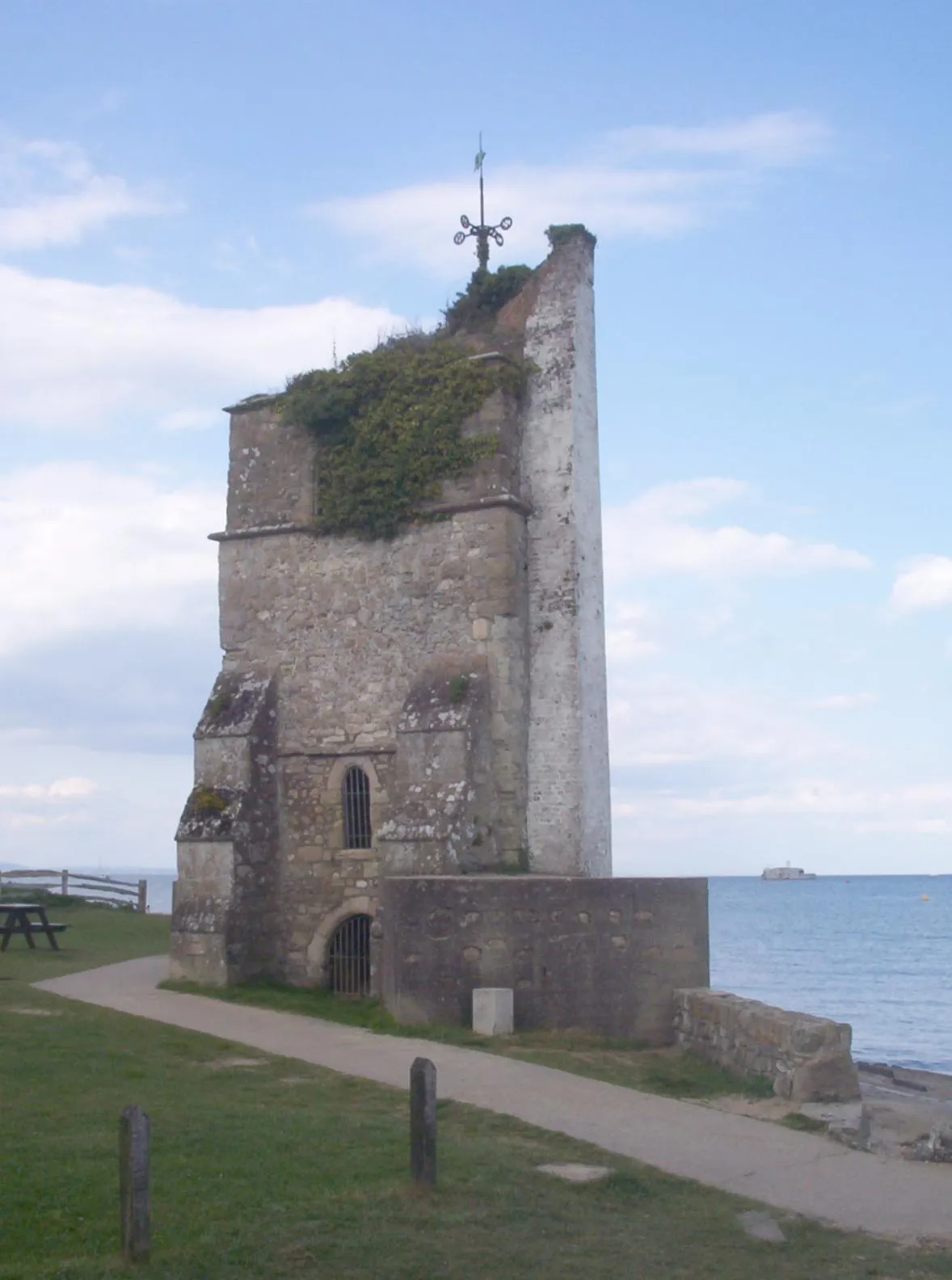 Photo showing: The ruin of the old church tower at St Helens, Isle of Wight. St Helens Fort is in the background.