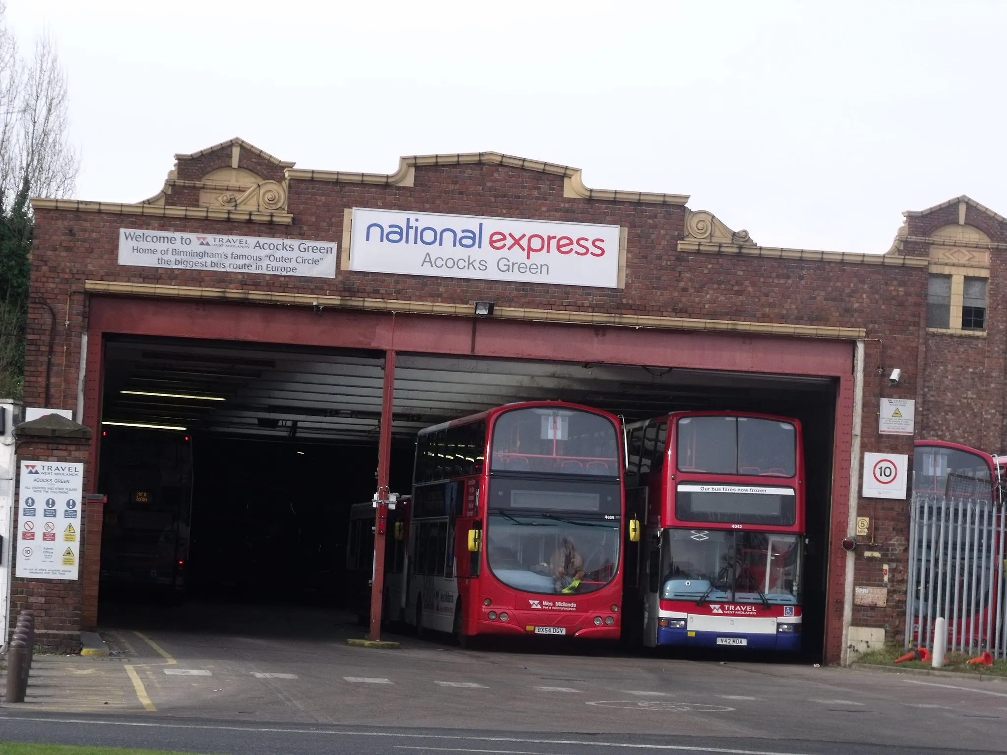 Photo showing: My local bus garage. Saw a possibly shot going on the bus towards Acocks Green, and took it walking back.
It is on Fox Hollies Road, directly ahead of Westley Road.
These are the two buses that made me think it would make an interesting shot.
Bus no.'s 4665 and 4042. The bus on the left is a no 11 bus (could be used on both 11A and 11C I would guess).
Taken from the other side of the road as I left Westley Road for Fox Hollies Road.
4665 is a Volvo B7TL / Wright Eclipse Gemini.

4042 is a Volvo B7TL / Plaxton President.