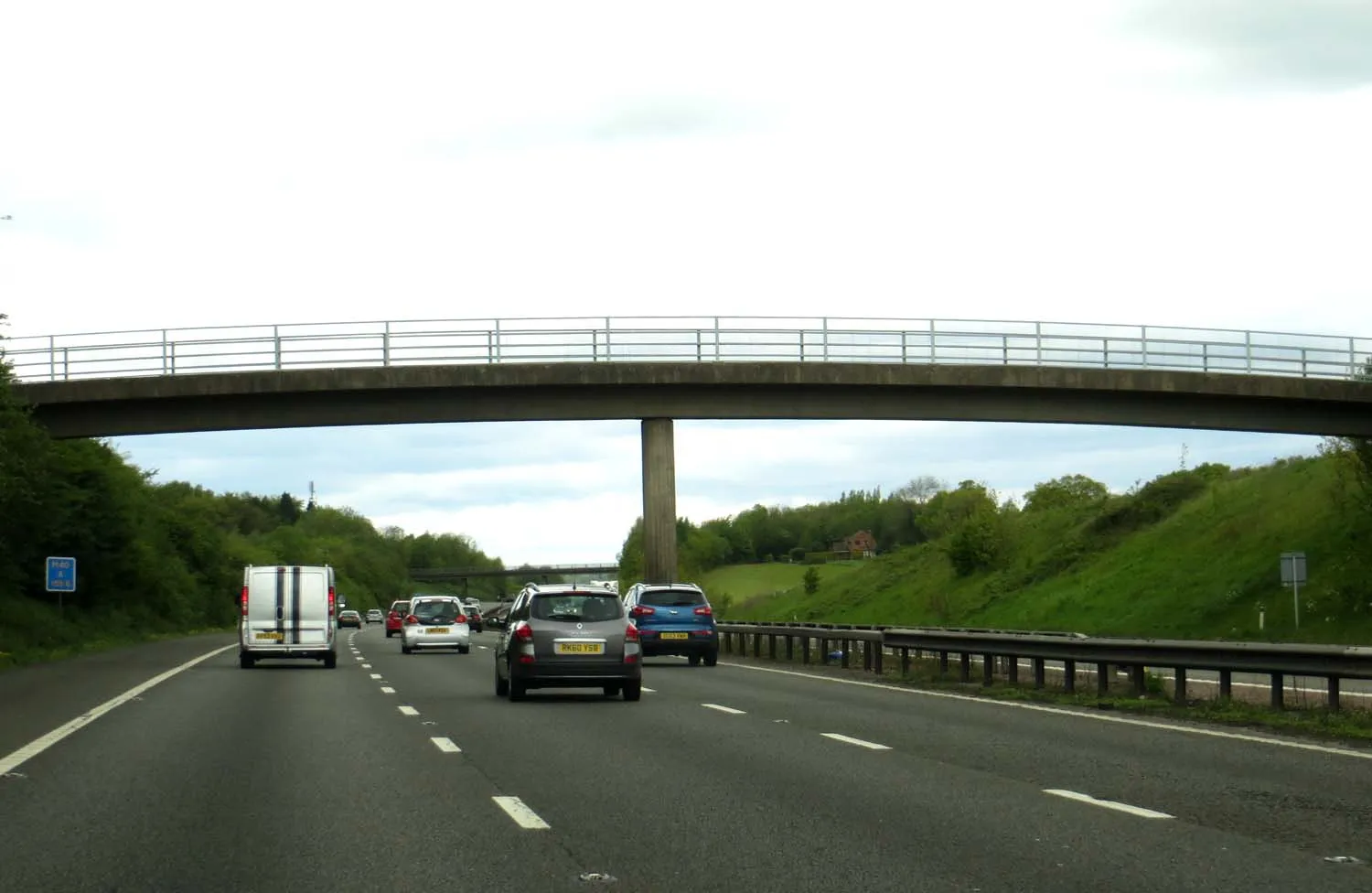 Photo showing: A farm track and footbridge over the M40