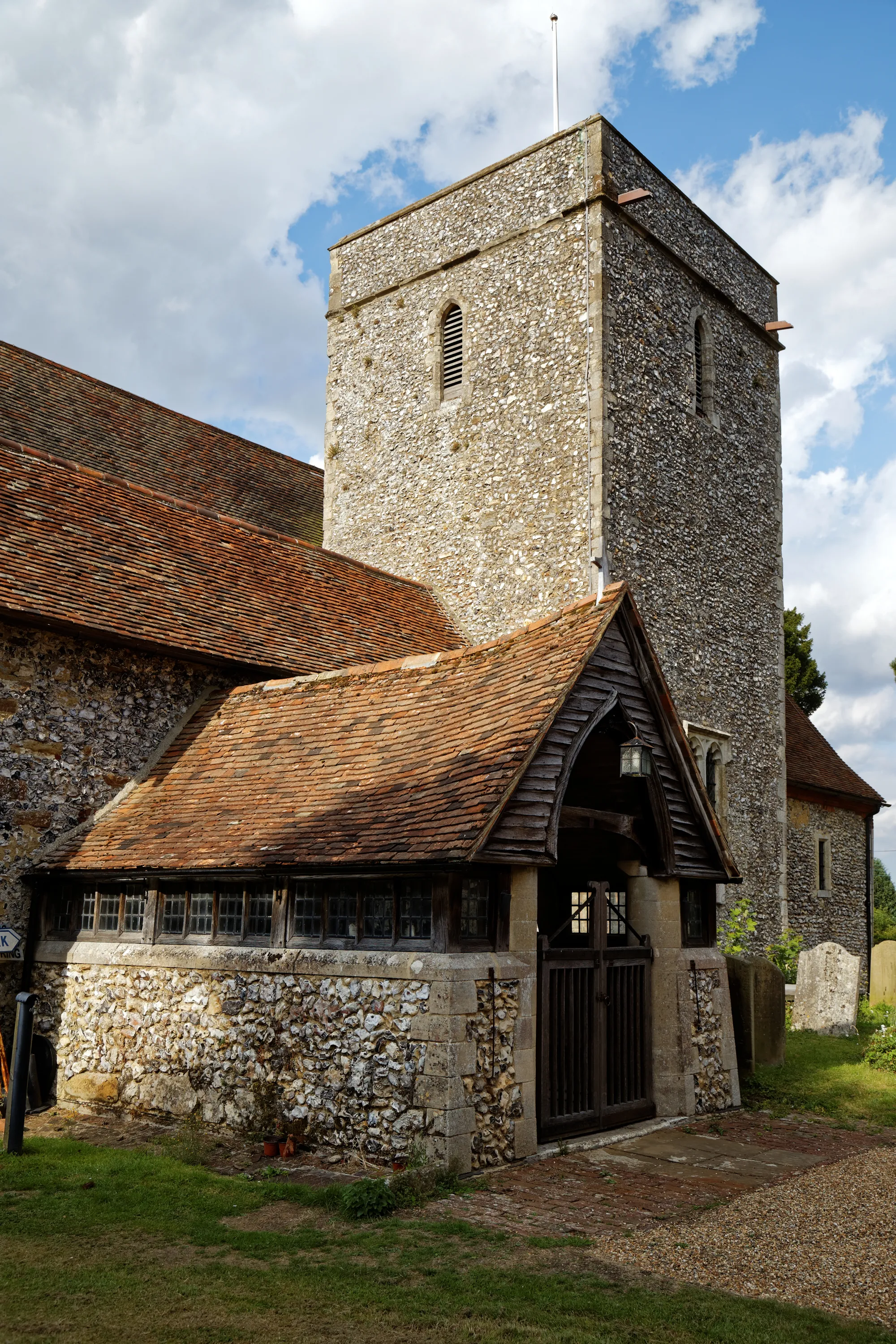 Photo showing: The south-west view of the gated porch and tower of the Church of St Peter and St Paul in Upper Hardres village in Kent, England. Camera: Canon EOS 6D with Canon EF 24-105mm F4L IS USM lens. Software: RAW file lens-corrected, optimized, perhaps cropped, and converted to JPEG with DxO OpticsPro 11 Elite, and likely further optimized with Adobe Photoshop CS2.