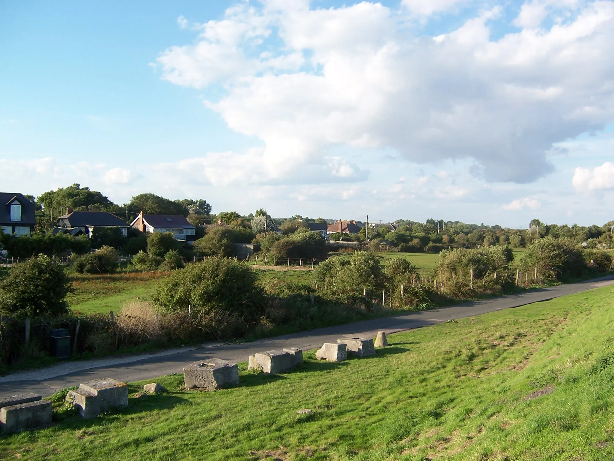 Photo showing: Seaside bungalows seen from the Environment Agency's road from Winchelsea Beach to Rye Harbour.