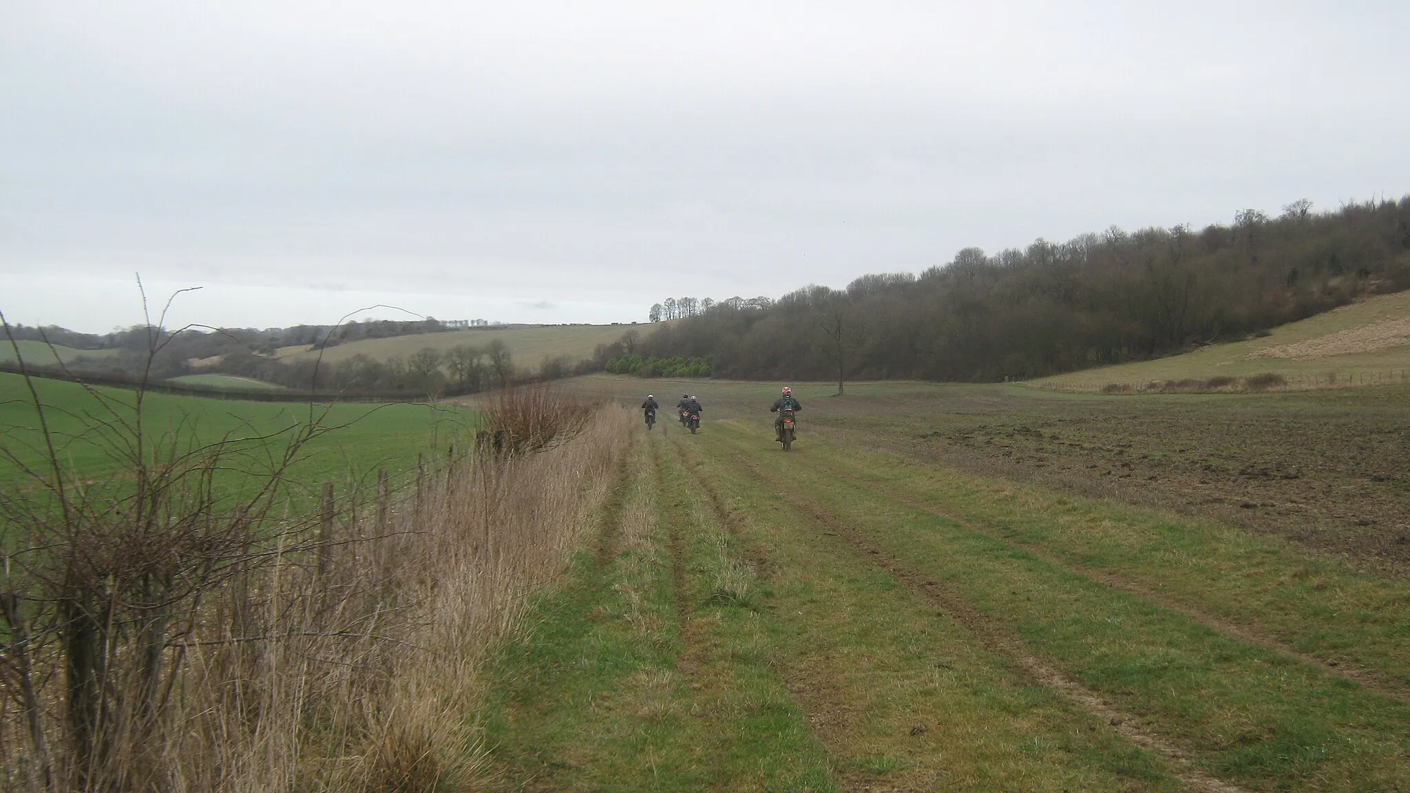 Photo showing: Bikers on the byway Four guys on motocross bikes are using the byways around the Crundale Downs for 'powered' fun. This byway leads from Pett Street Farm towards Crundale House.