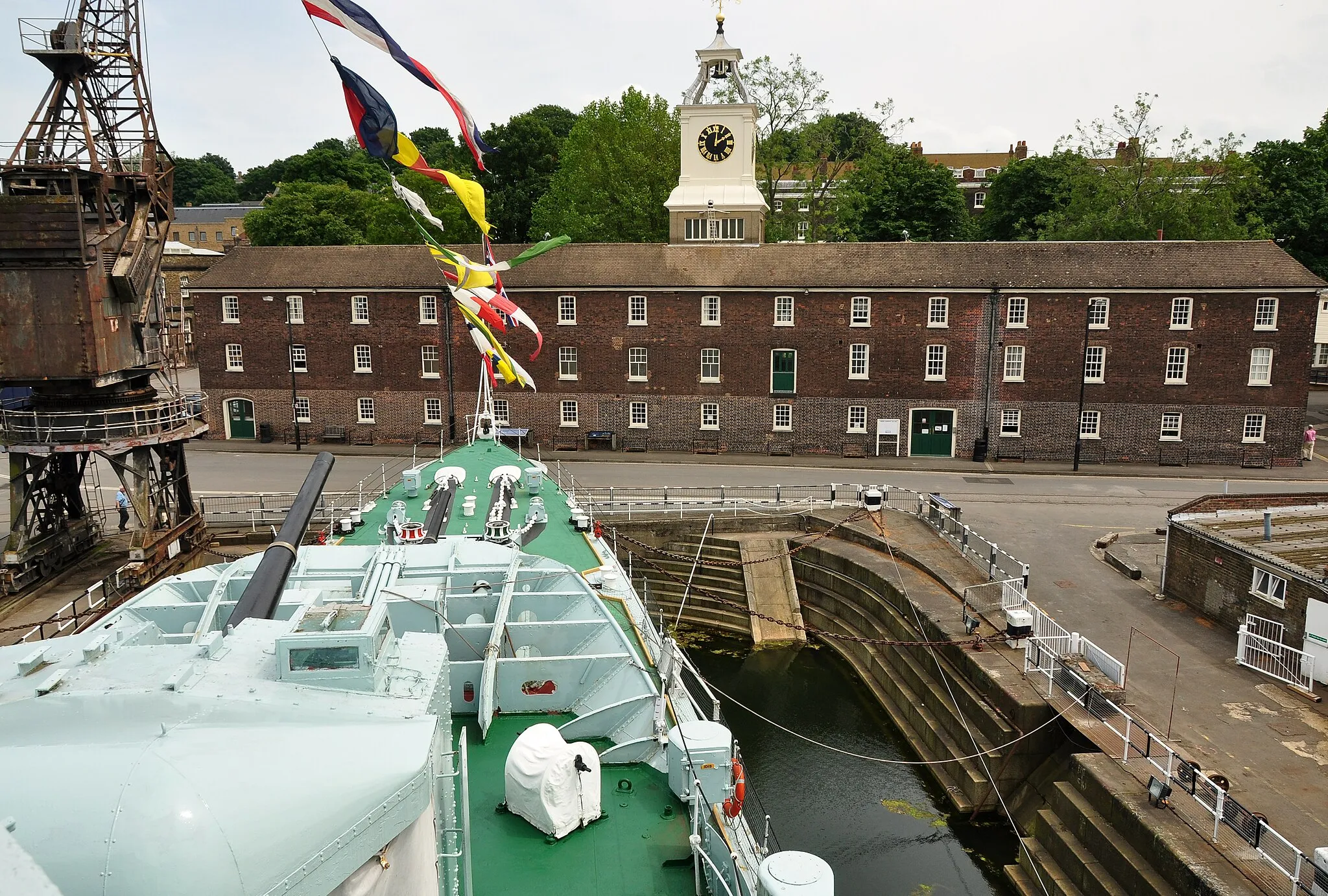 Photo showing: The Clock Tower Building in Chatham Dockyard, Kent, seen from the bridge of HMS Cavalier.