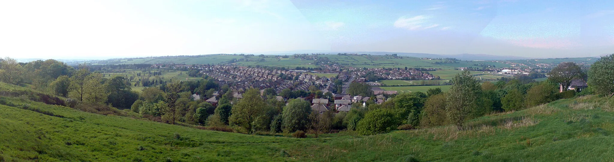 Photo showing: View from the site of the old water tank at the top of Revidge in Blackburn, UK. Shows (from East to West) Blackburn golf course, Beardwood, Lammack and Pleckgate. Lammack Road can be seen in the centre of the picture leading up to Ramsgreave in the North.