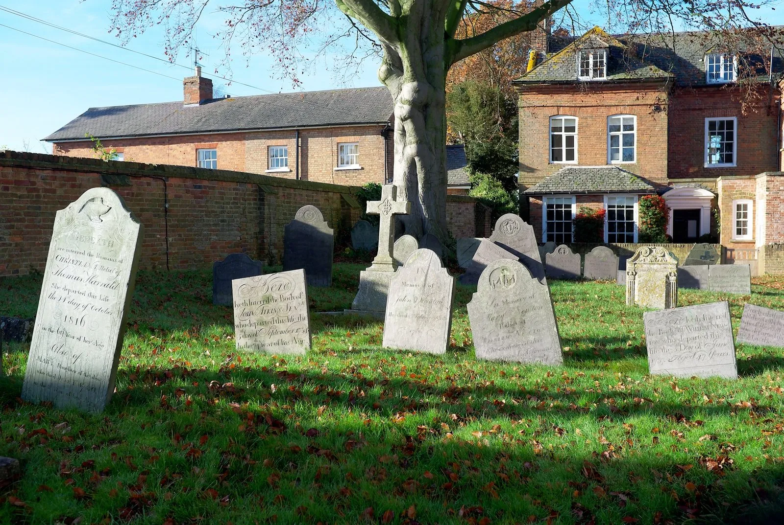 Photo showing: The churchyard of the interesting mediaeval church is rich in fine Swithland slate headstones.