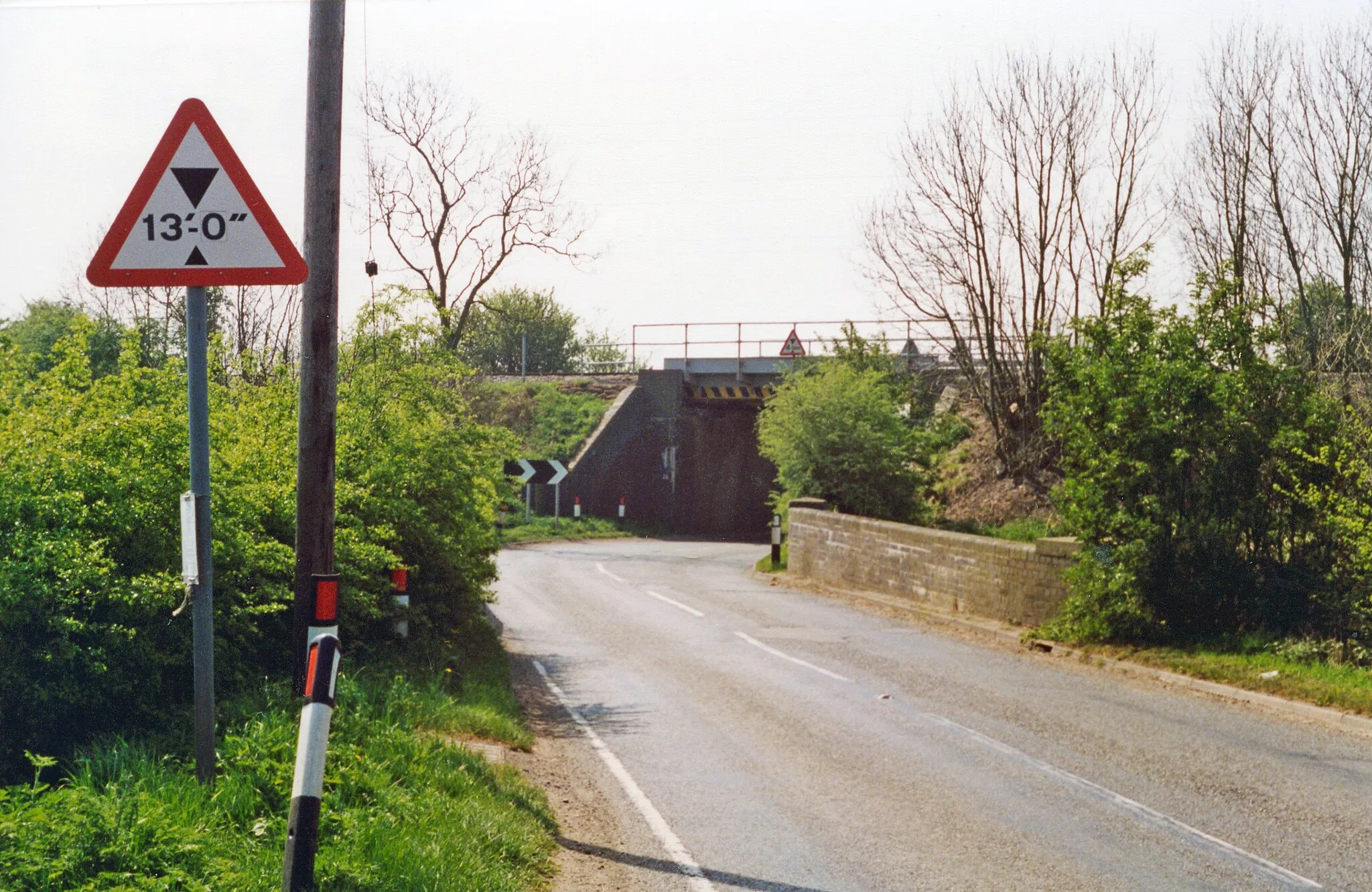 Photo showing: Site of former East Langton station.
View southward on B6047, to the bridge carrying the ex-Midland London St Pancras - Kettering (to left) - (to right) Leicester and the North. The station, which had been on the left, was closed from 1/1/68.