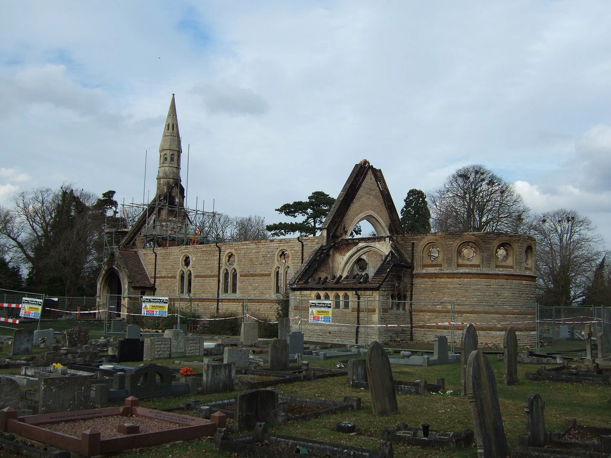 Photo showing: Nine days after the fire. St Mary's church, Westry near March was completely gutted by a fire on Monday 15th March 2010 following a suspected arson attack. During the following few days all the charred remains of the roof timbers were removed, by David Humphrey and Son, along with small amounts of masonry, most noticeably the stone cross on the gable end. On the day of this photo scaffolding was being erected around the small bell tower. 1757028