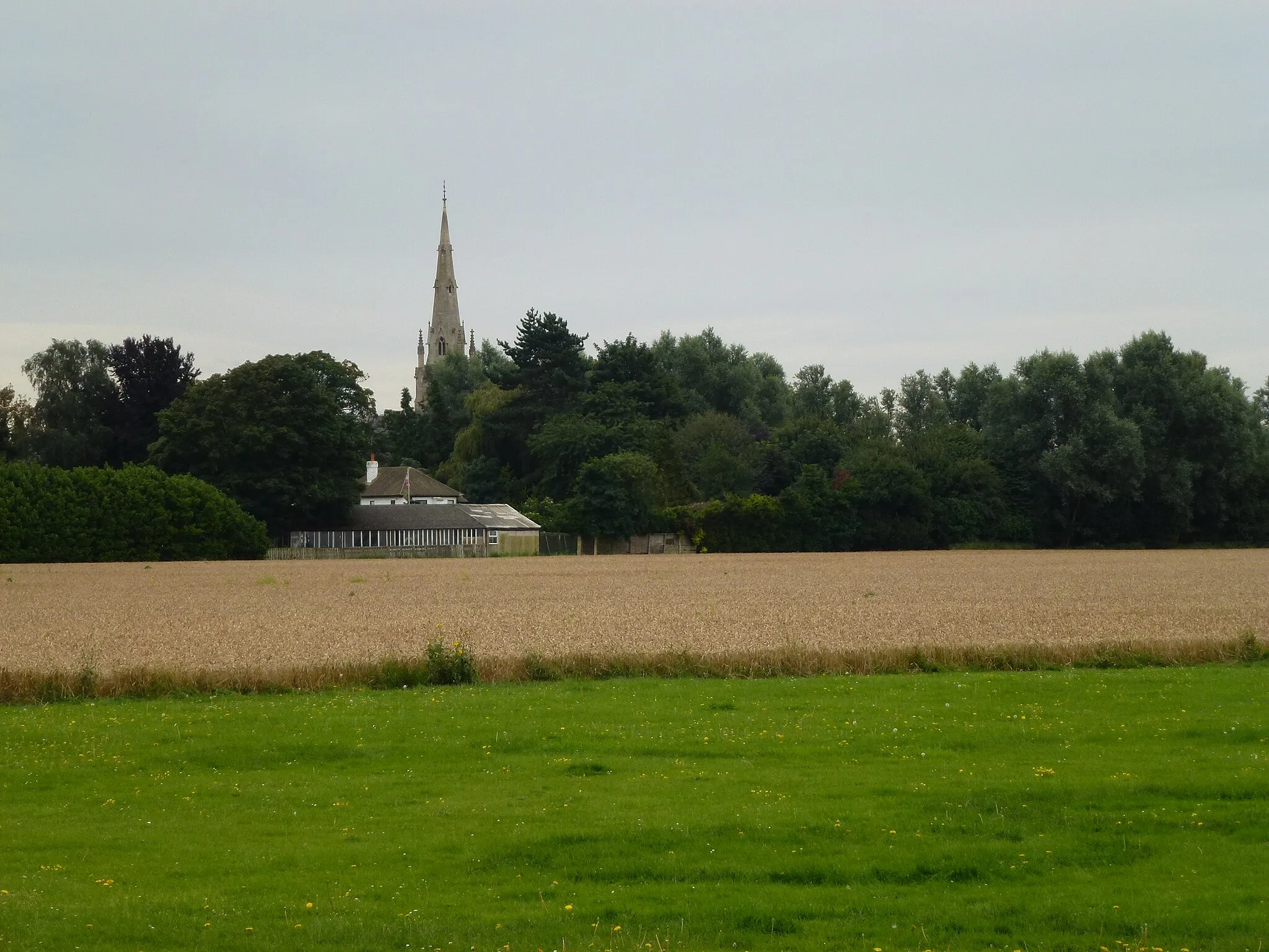 Photo showing: A distant view of the church, Deeping St Nicholas