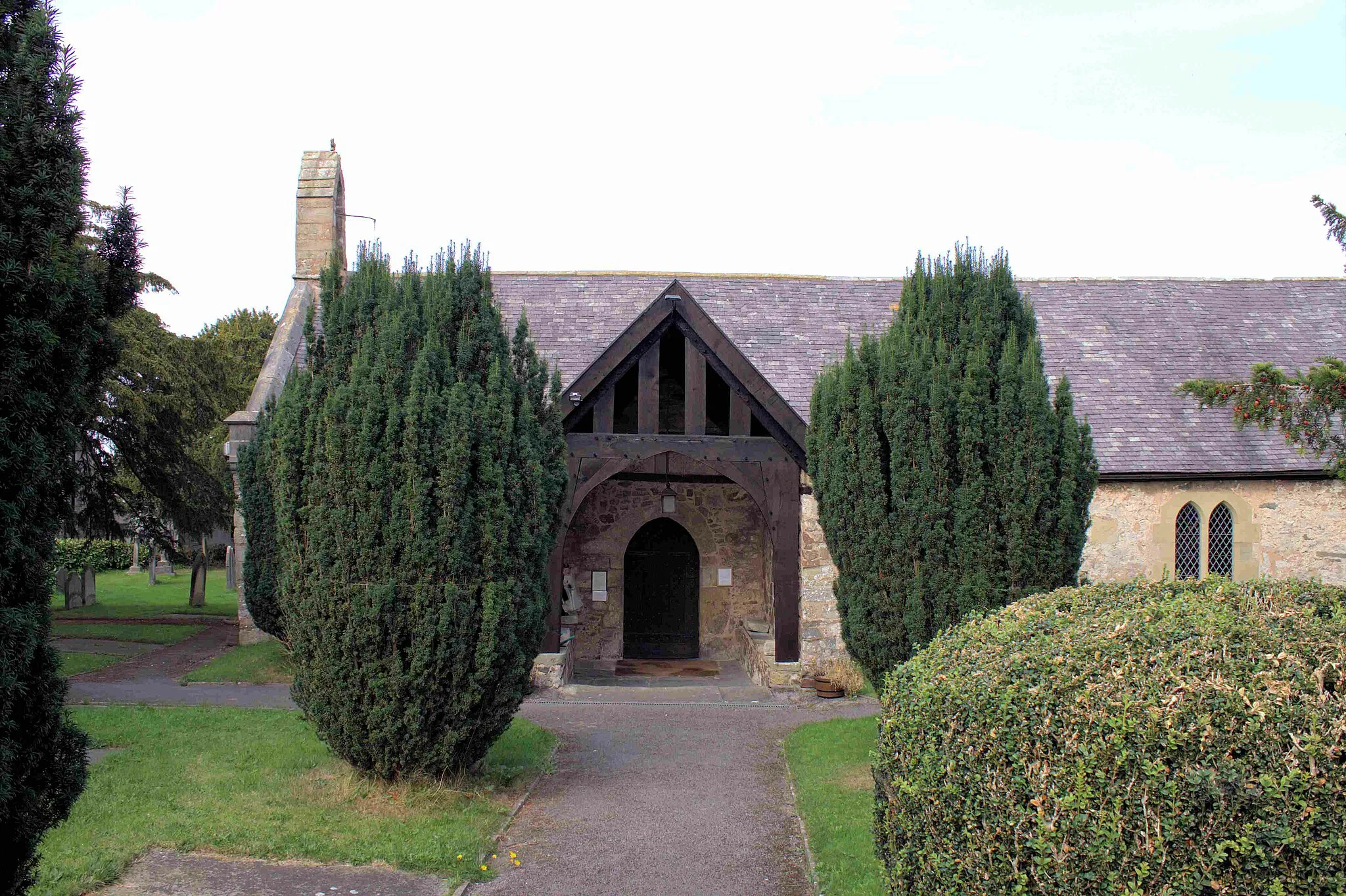 Photo showing: Corpus Christi, Tremeirchion, Denbighshire - a Grade II* 14th century church, between the village school and the inn, has an 800 year old yew tree, and was renowned for a wonder-working cross: dating mainly from the 14th and 15th centuries. Has a mail-clad knight of about 1280 carved from stone.