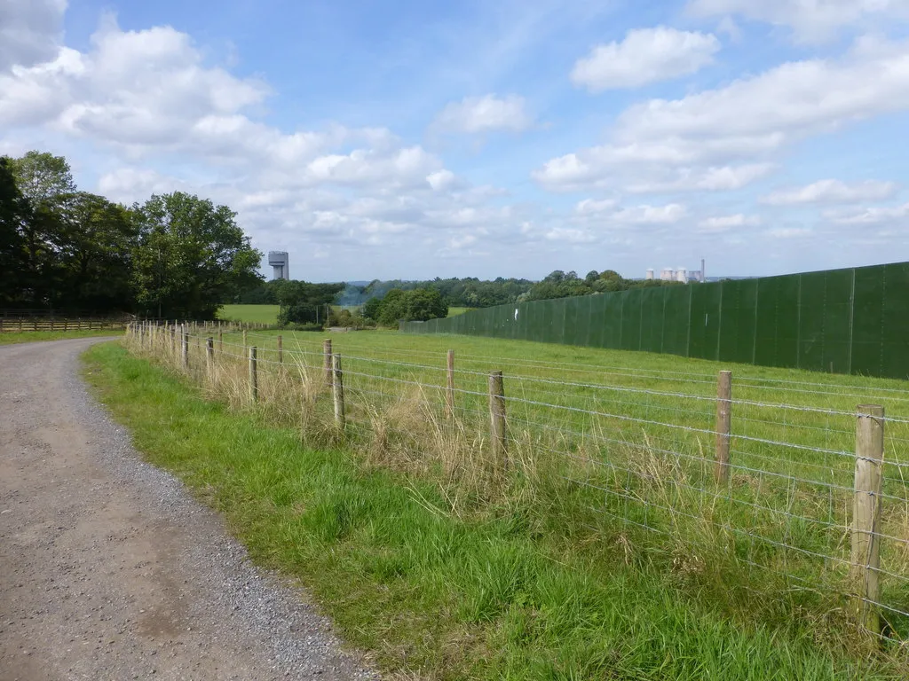 Photo showing: Farm track skirts Creamfields site near Outer Wood