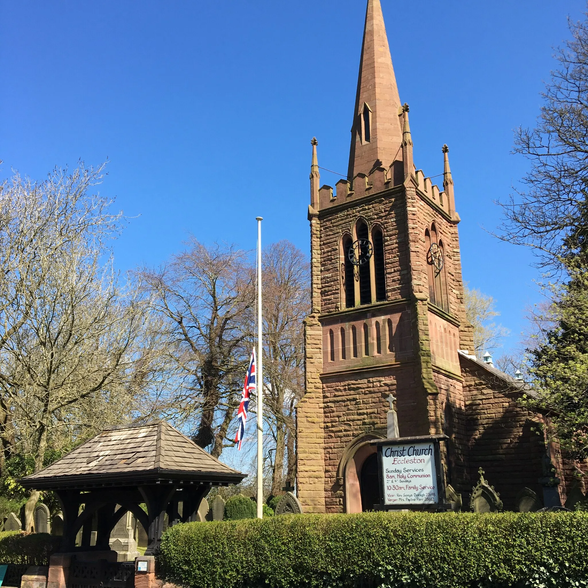 Photo showing: Christ Church in the village of Eccleston near St Helens, pictured with union flag flying at half-mast following the death of Prince Philip, husband of Queen Elizabeth II.