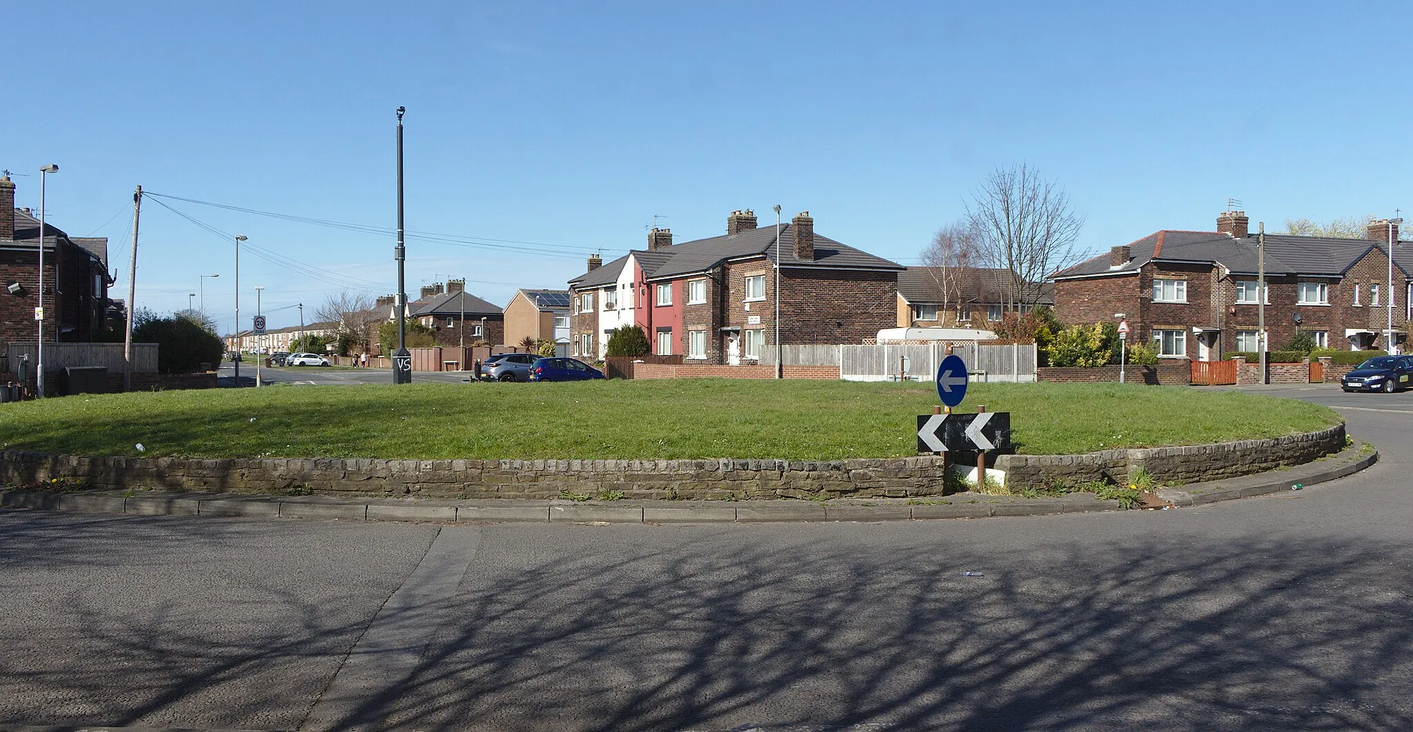 Photo showing: Large but uninspiring roundabout at the junction of Kirkstone Road North and Moss Lane, Litherland