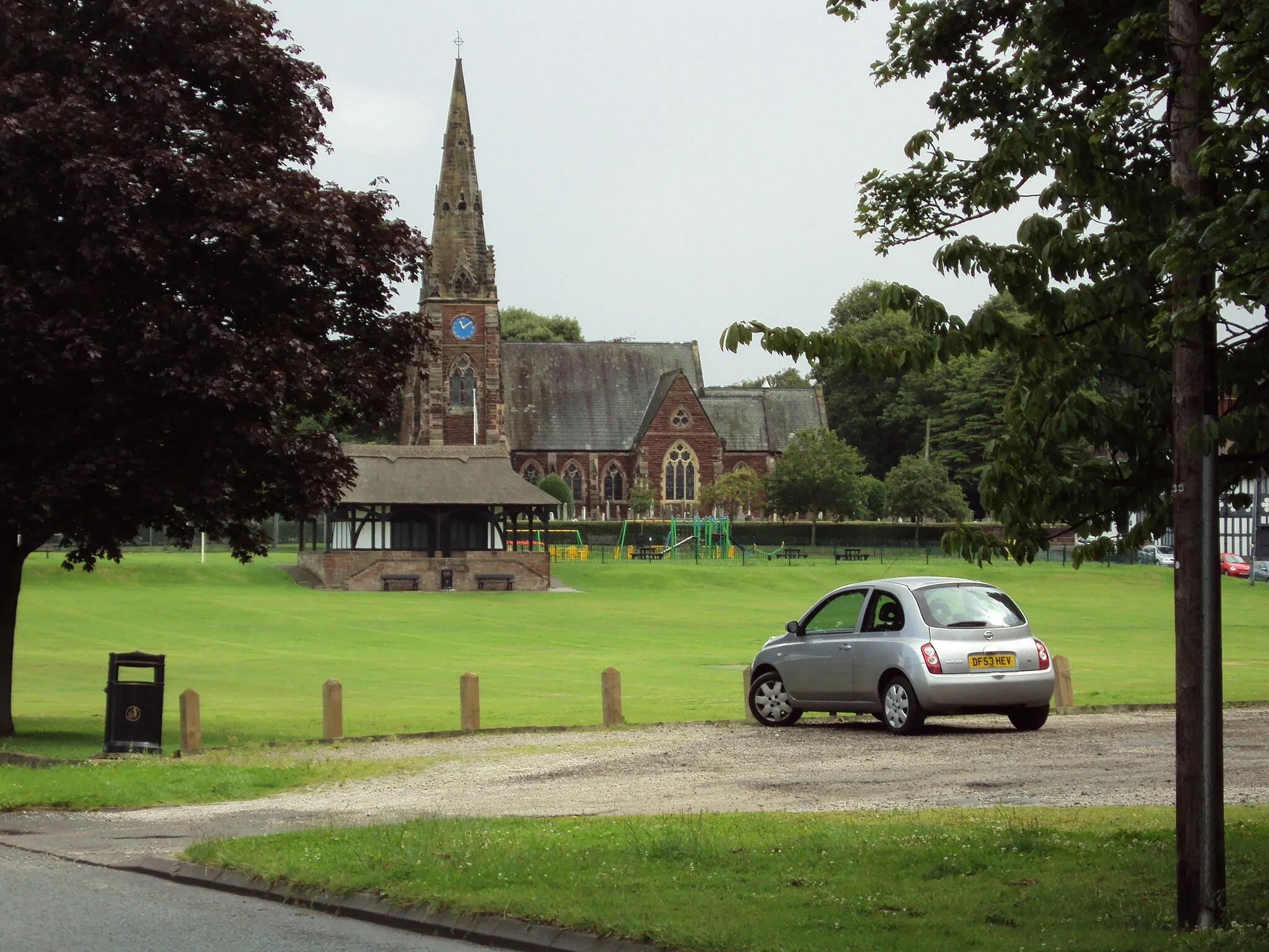 Photo showing: Village green and church at Thornton Hough, Wirral, England.