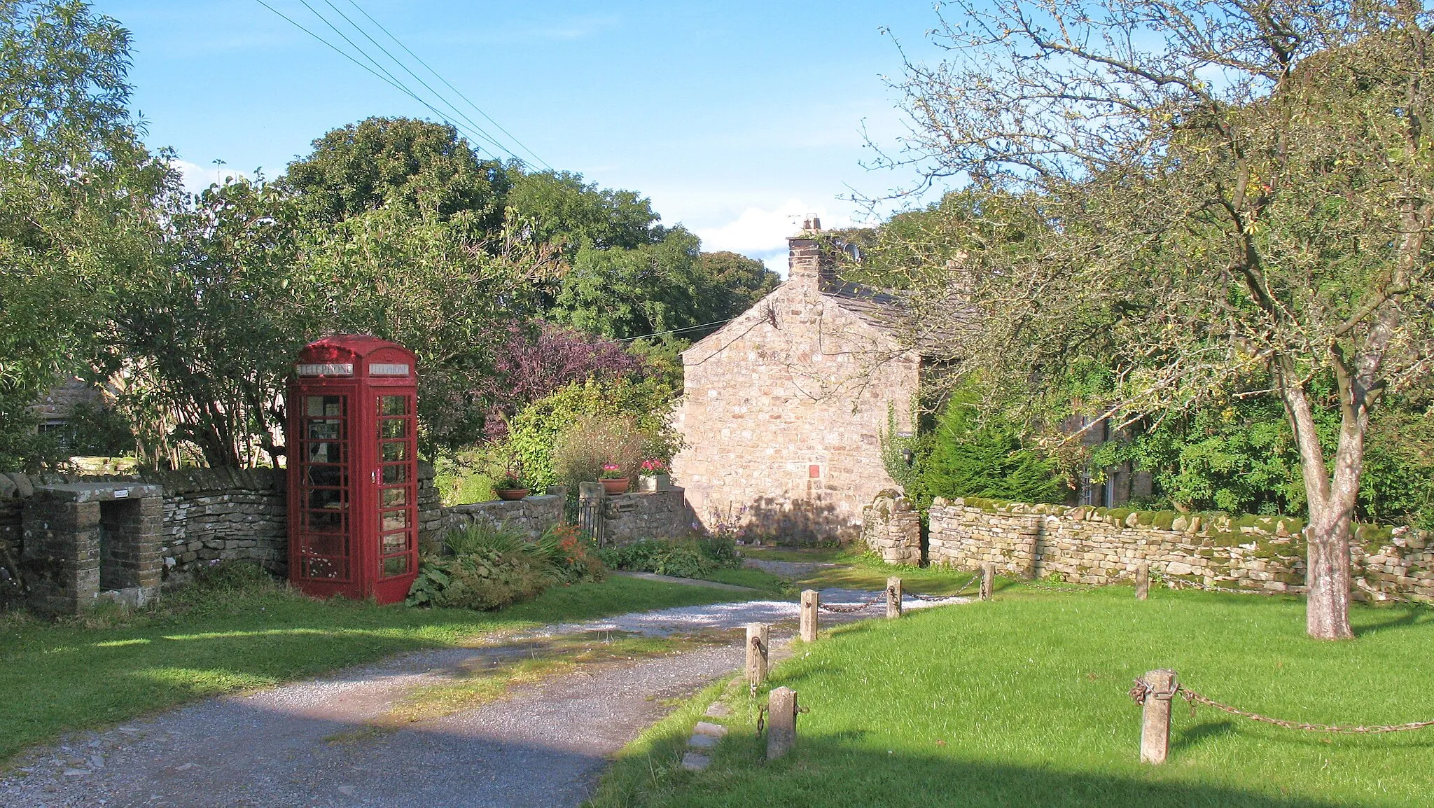 Photo showing: Telephone kiosk and green at West Scrafton