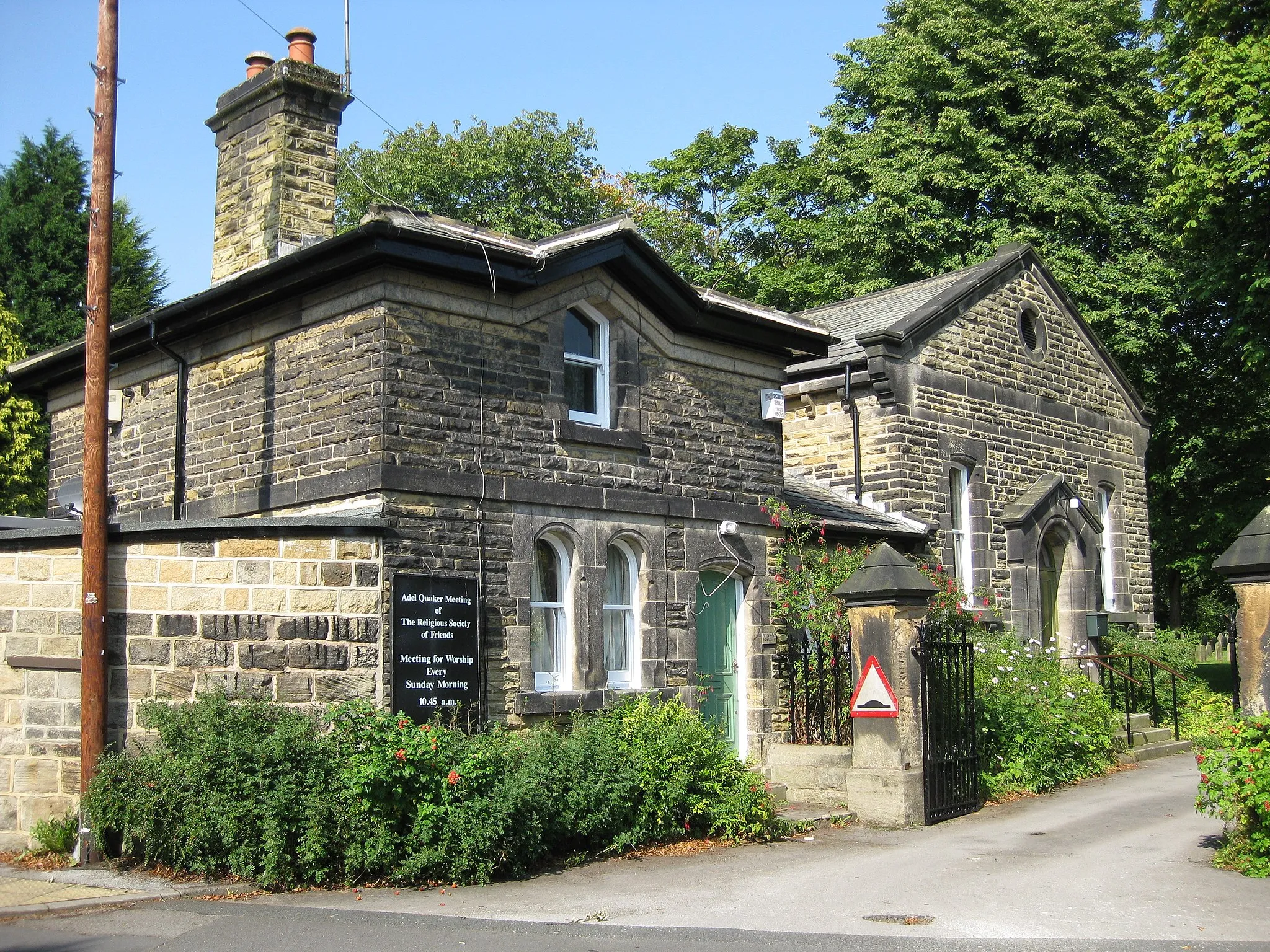 Photo showing: Adel Friends' Meeting House (right) and lodge (left), New Adel Lane, Leeds, West Yorkshire, seen from the southeast. Built in 1868.