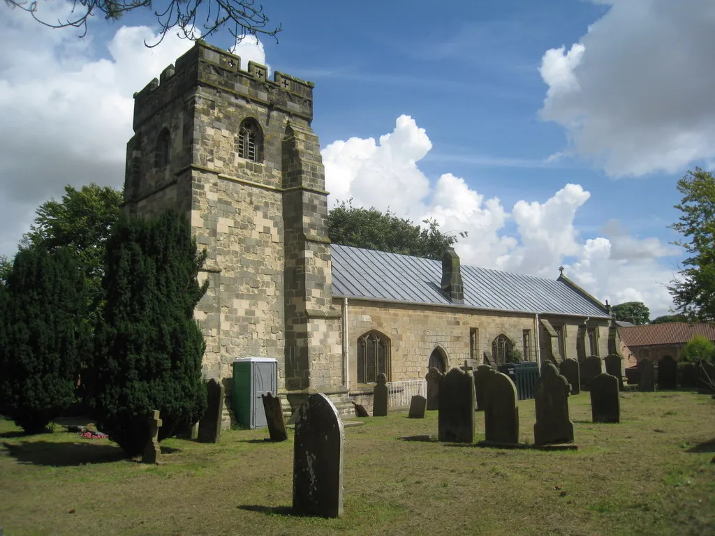 Photo showing: St. Nicholas Church, Wetwang, East Riding of Yorkshire, England. A portable toilet is the answer. Most churches are listed buildings and getting consent to install toilet facilities is often far from easy and prohibitively expensive. So the answer, as here at St. Nicholas, Wetwang, is a portable toilet.