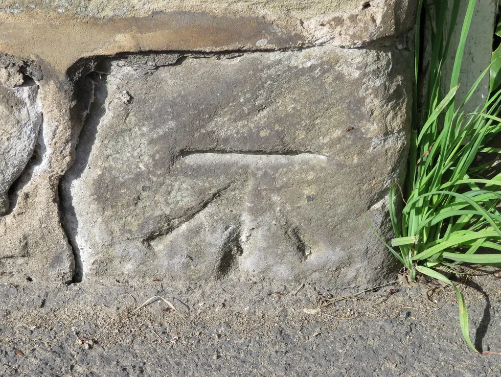 Photo showing: Bench mark on High Street, Burniston