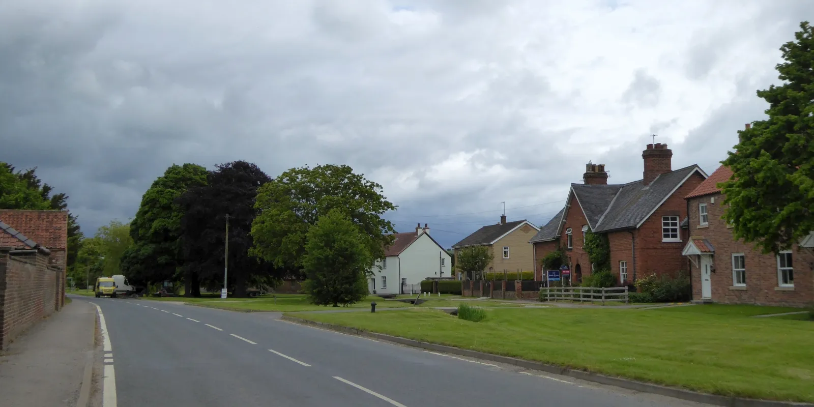 Photo showing: Road and stream through Helperthorpe