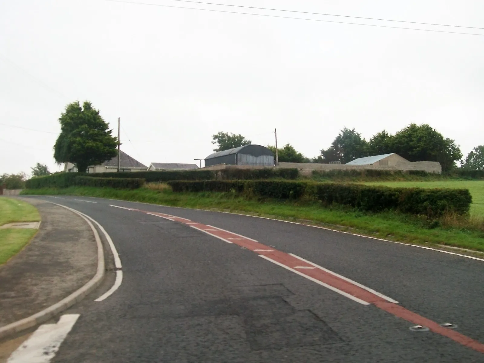 Photo showing: View east along Ballynahinch Road from the junction with Magheraconluce Road