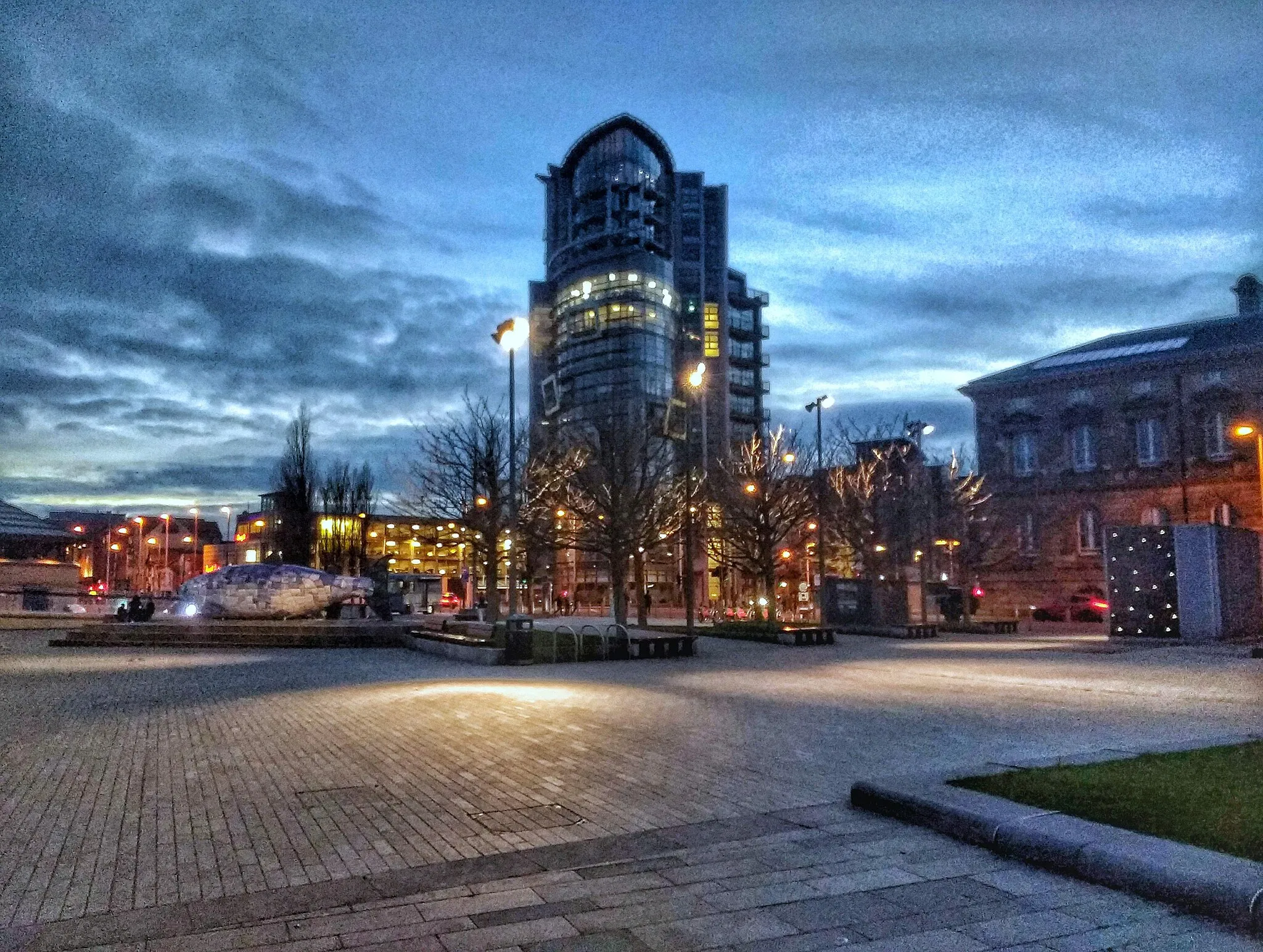 Photo showing: This is a photo of the City Quays. It shows a recreational ground with the Salmon of Knowledge and the Grafton recruitment building in the background.