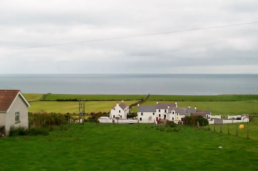 Photo showing: A modern-day clachan of houses west of Ballintoy Parish Church