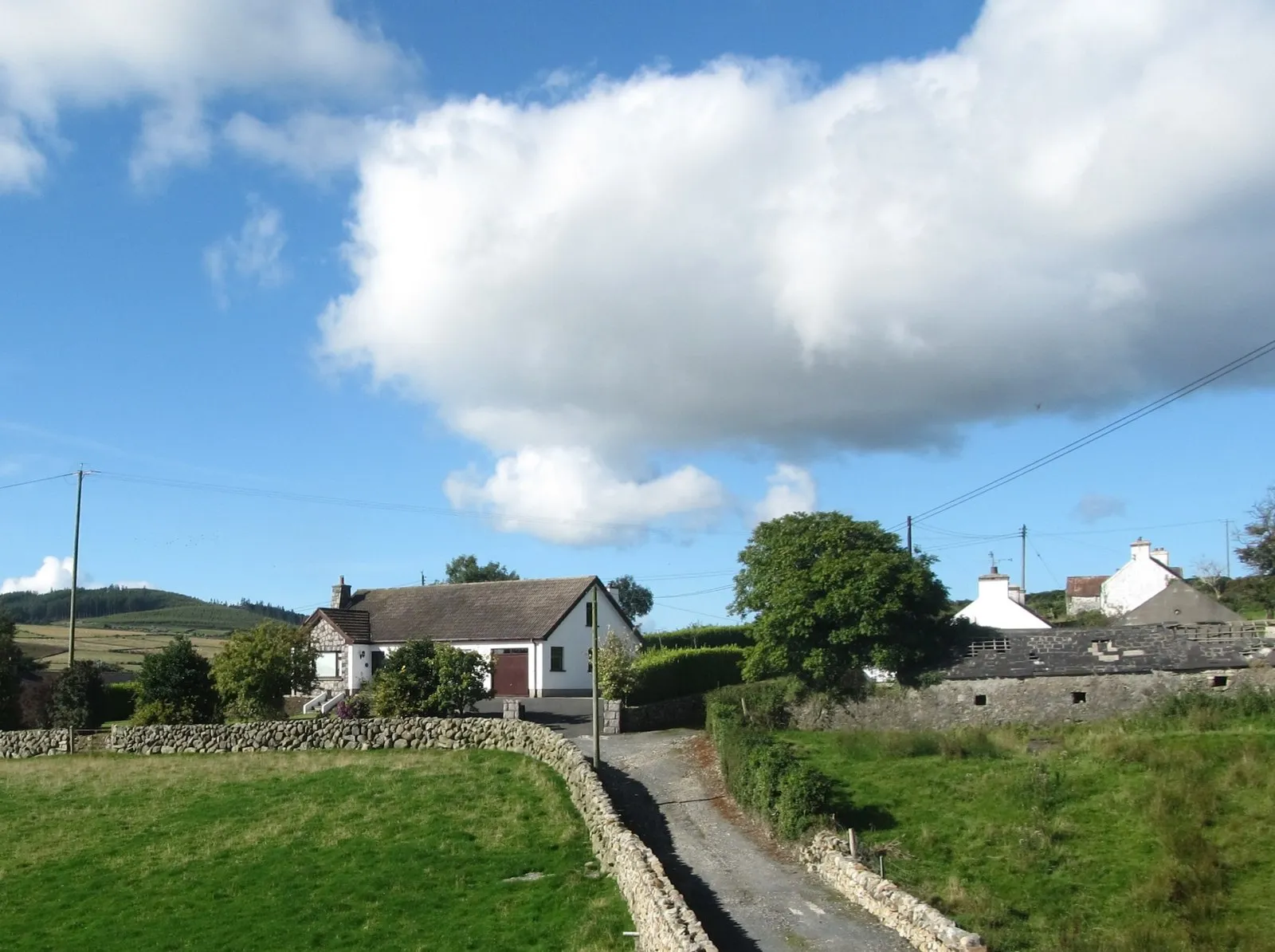 Photo showing: A clachan of homesteads on the west side of Moyad Road
