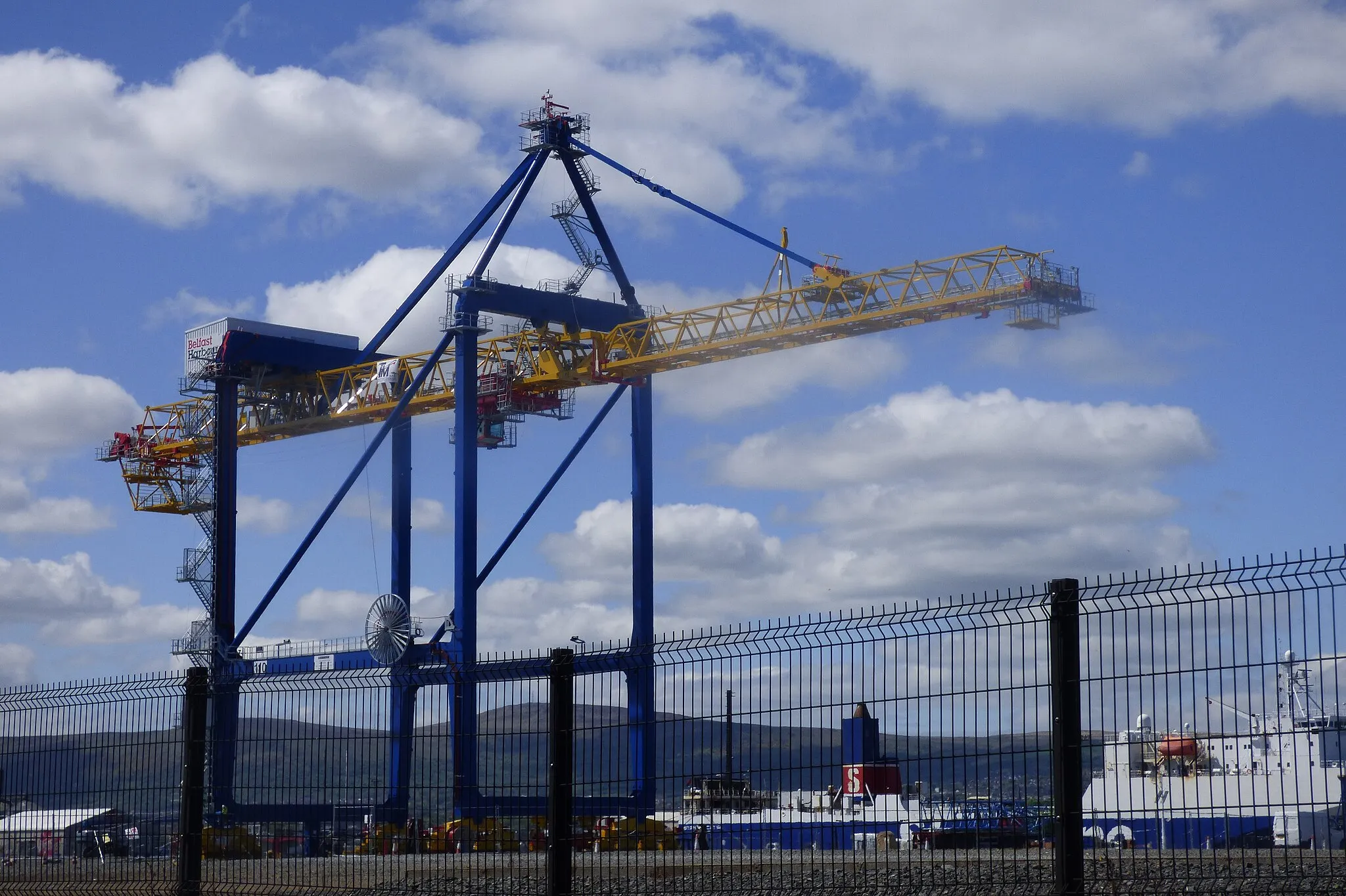 Photo showing: The first of Belfast port's new Liebherr gantry container handling cranes assembled, awaiting transfer across the channel to VT3. Stena ferries in the background.